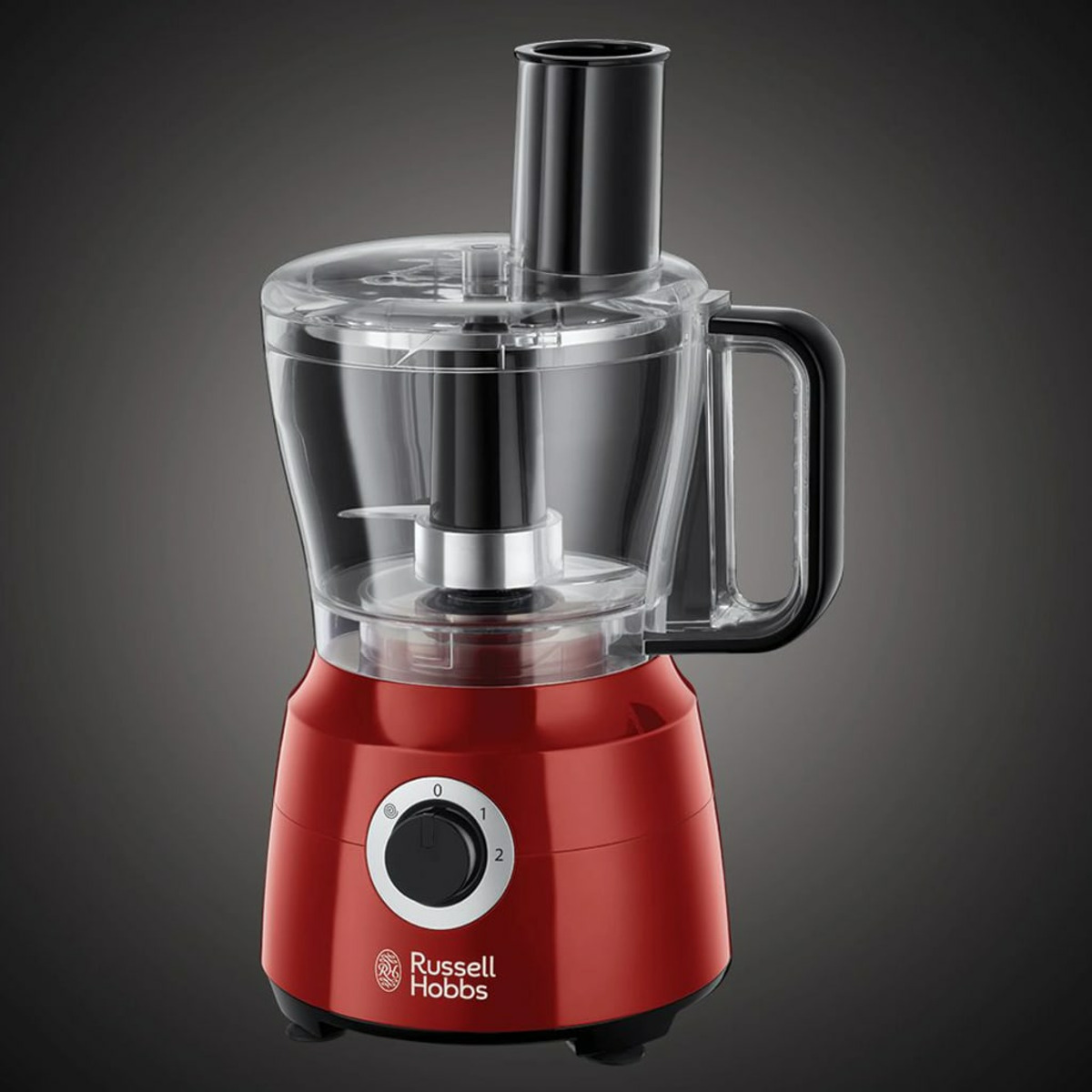 Roter Food-Processor mit schwarzem Griff und Bedienelementen. Der Behälter hat eine Klinge.