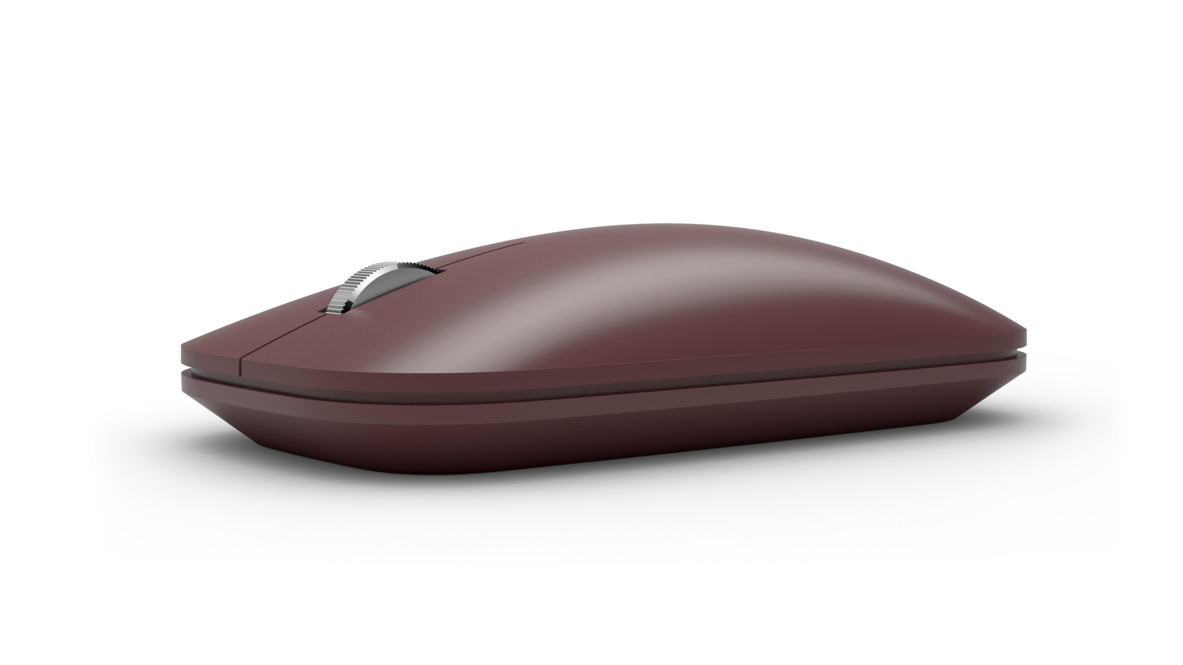 Un mouse wireless marrone con rotella di scorrimento argentata, su sfondo bianco.