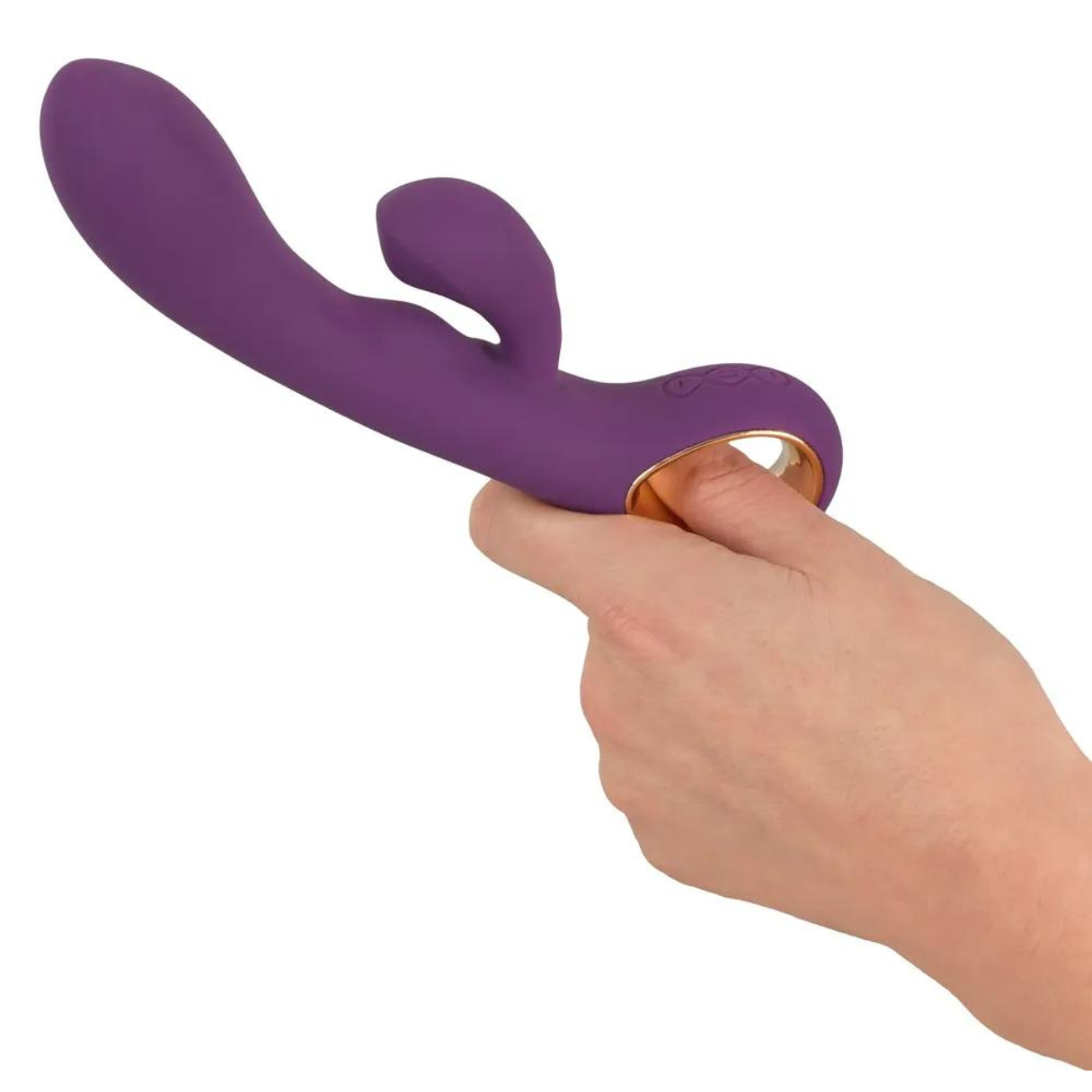 Ein lila Sexspielzeug, das von einer Hand auf weißem Hintergrund gehalten wird. Es hat zwei Beulen und einen Goldring.
