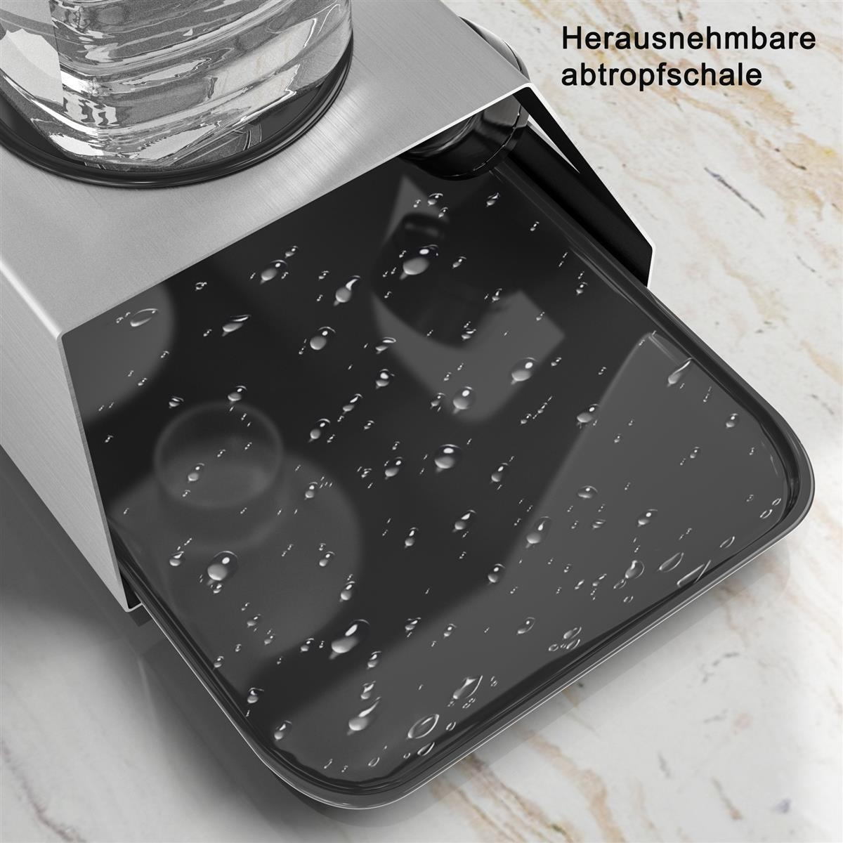 Nahaufnahme einer schwarzen, rechteckigen Abtropfschale mit Wassertropfen, in einem silbernen Gerät.