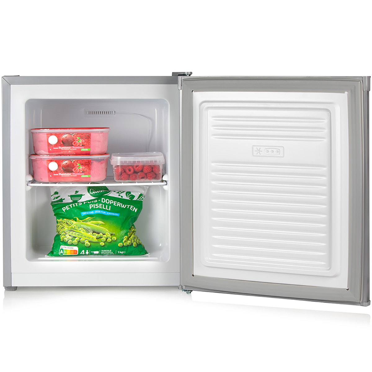 Open freezer with frozen peas, ice cream, and raspberries inside.
