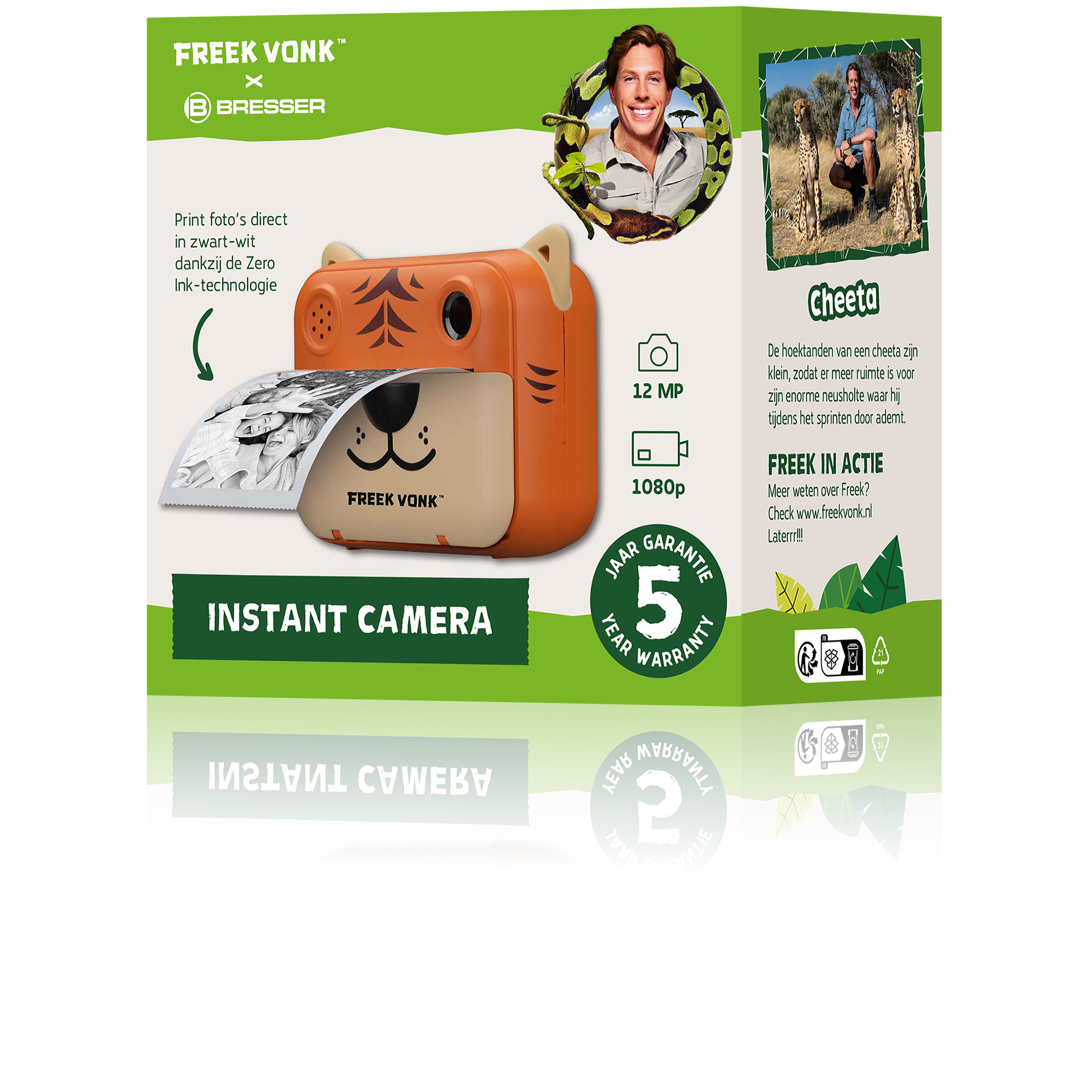 Cámara instantánea de juguete en naranja con diseño de tigre. El paquete muestra foto impresa. Fondo blanco.