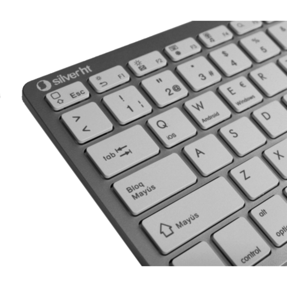 Klawiatura z białymi klawiszami. Klawiatura ma srebrną ramkę. Widoczny jest lewy górny róg.