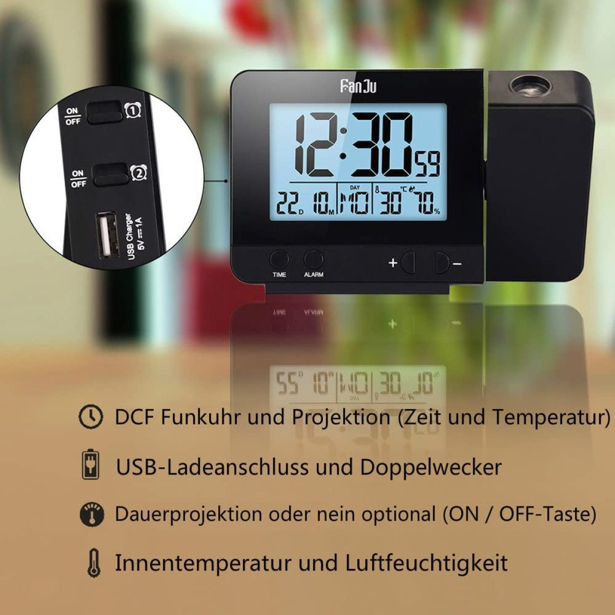 Schwarze Digitaluhr mit Projektionsfunktion. USB-Ladegerät sichtbar. Weißer Hintergrund.