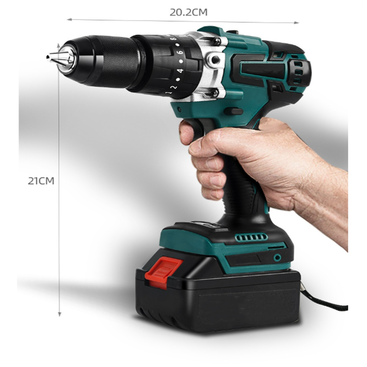 Ein elektrischer Bohrer, in der Hand gehalten, mit Messungen.