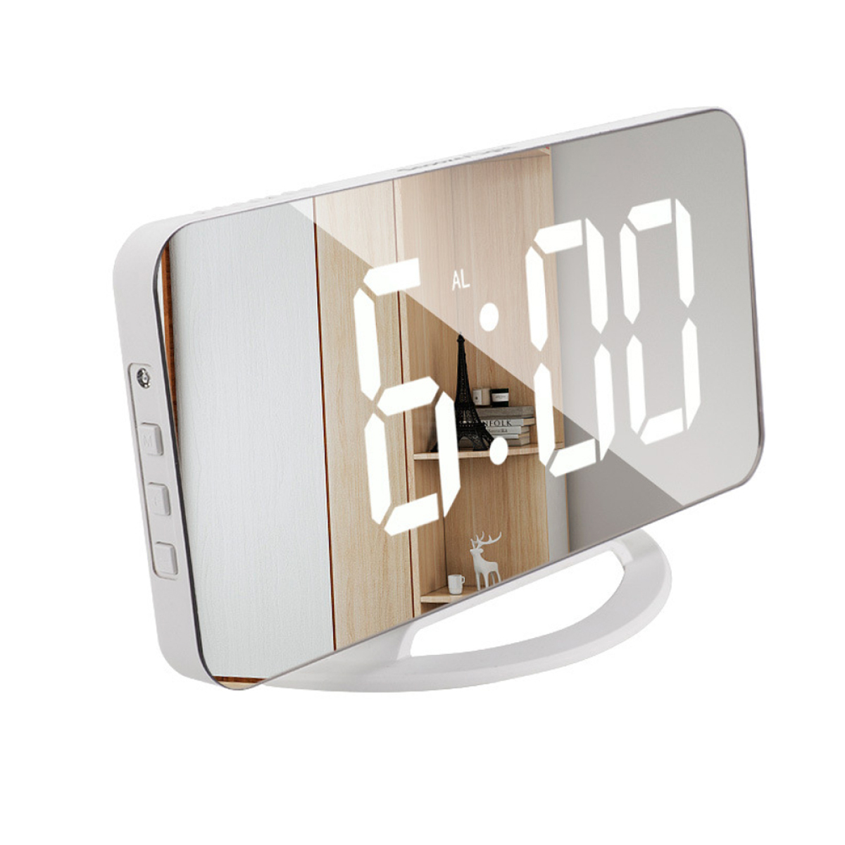 Eine weiße, moderne Digitaluhr zeigt 6:00 an. Sie steht auf einem weißen Ständer. Dahinter ist ein Schrank.