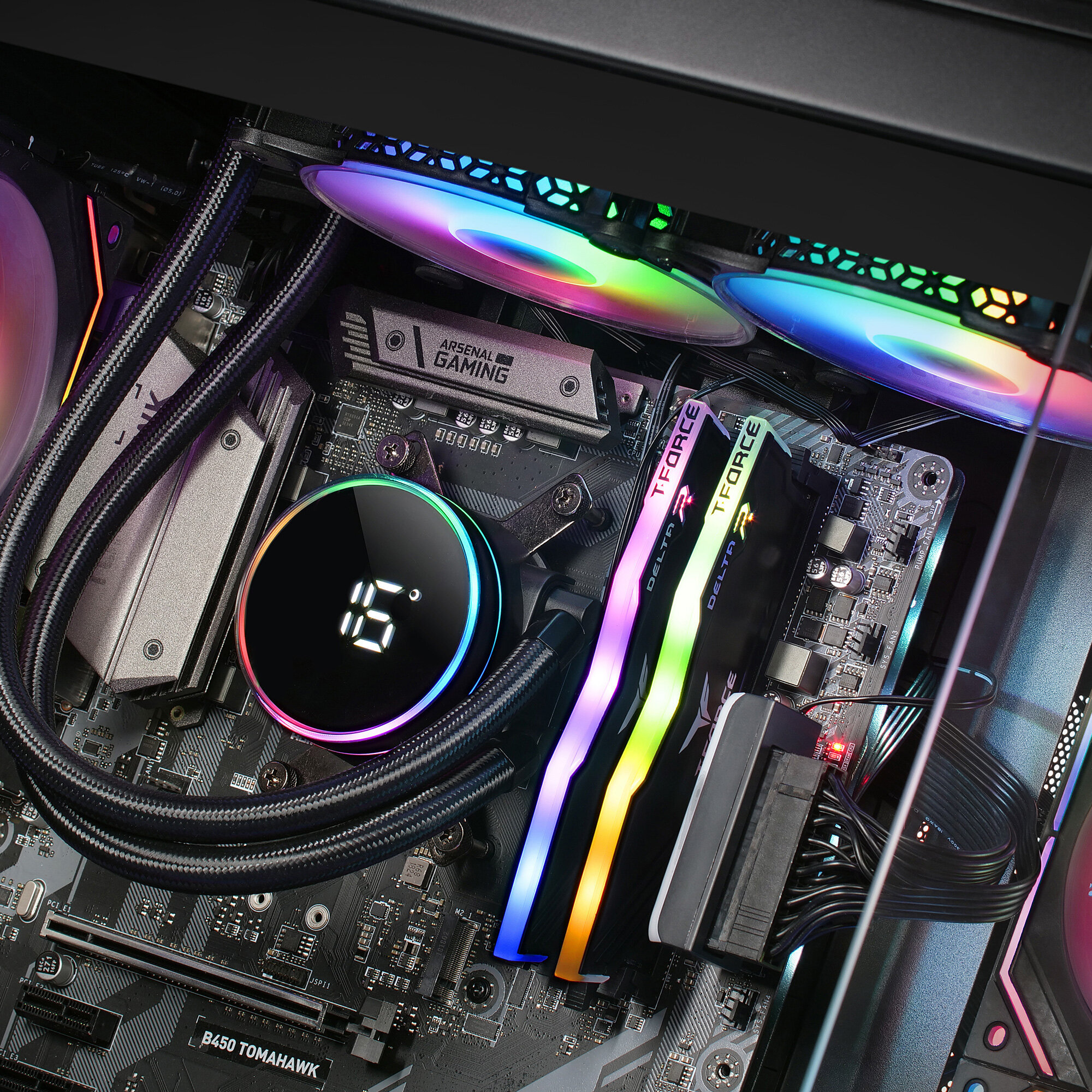 Wnętrze komputera z chłodzeniem cieczą i kolorowymi światłami.