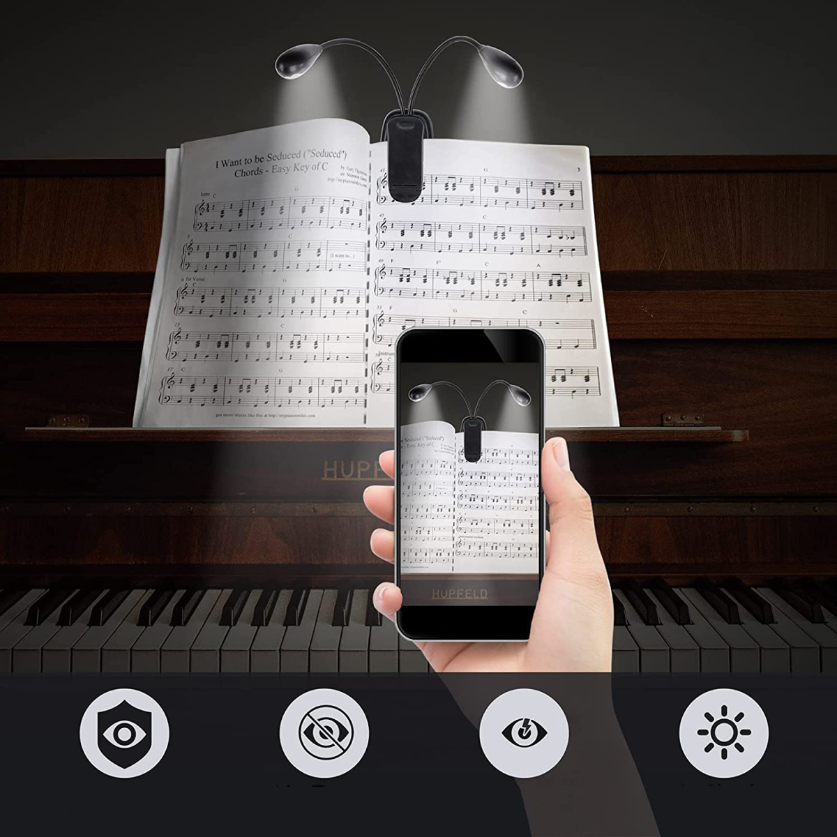 Schwarzes Clip-On-Licht auf Noten, Telefon mit Licht, mit Icons: Sicherheit, kein Auge, Auge und Sonne.