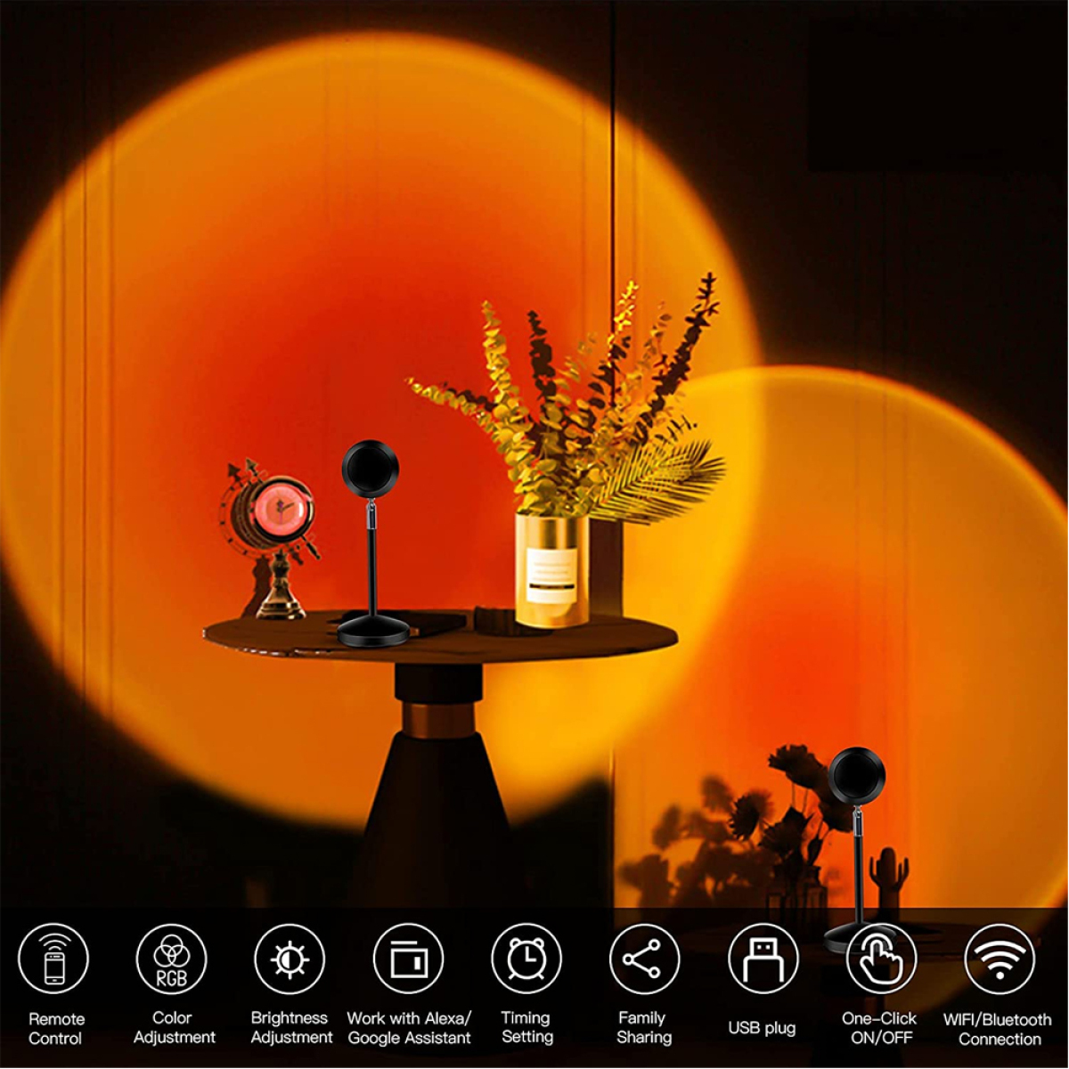 Sonnenuntergangslampe auf Tisch mit Uhr, Pflanze und Logo-Symbolen.