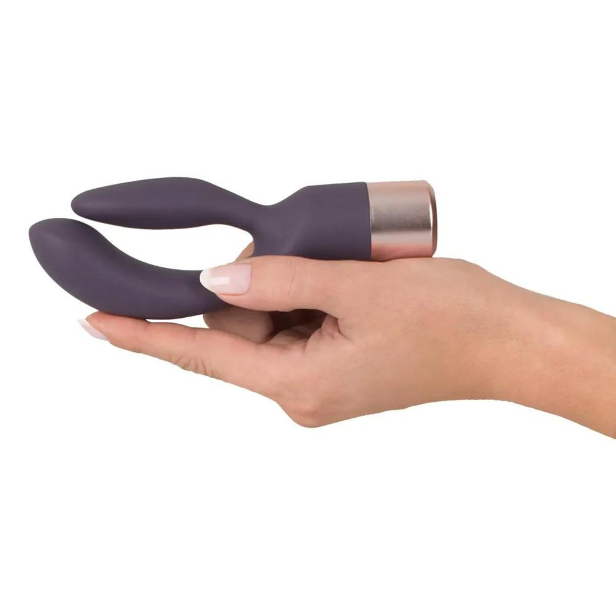 Hand hält ein lila und roségoldfarbenes Sexspielzeug. Das Spielzeug hat ein gebogenes, ergonomisches Design.