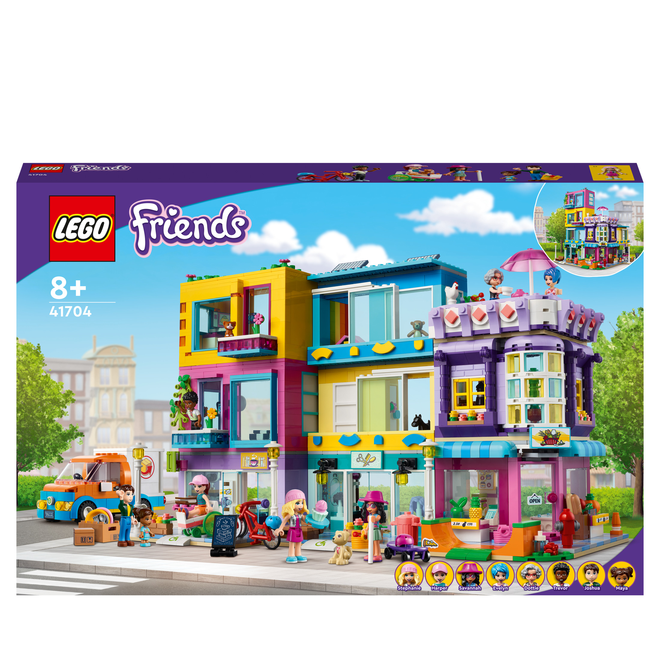 Een Lego Friends set doos met een kleurrijk gebouw met meerdere figuren en een bestelwagen.