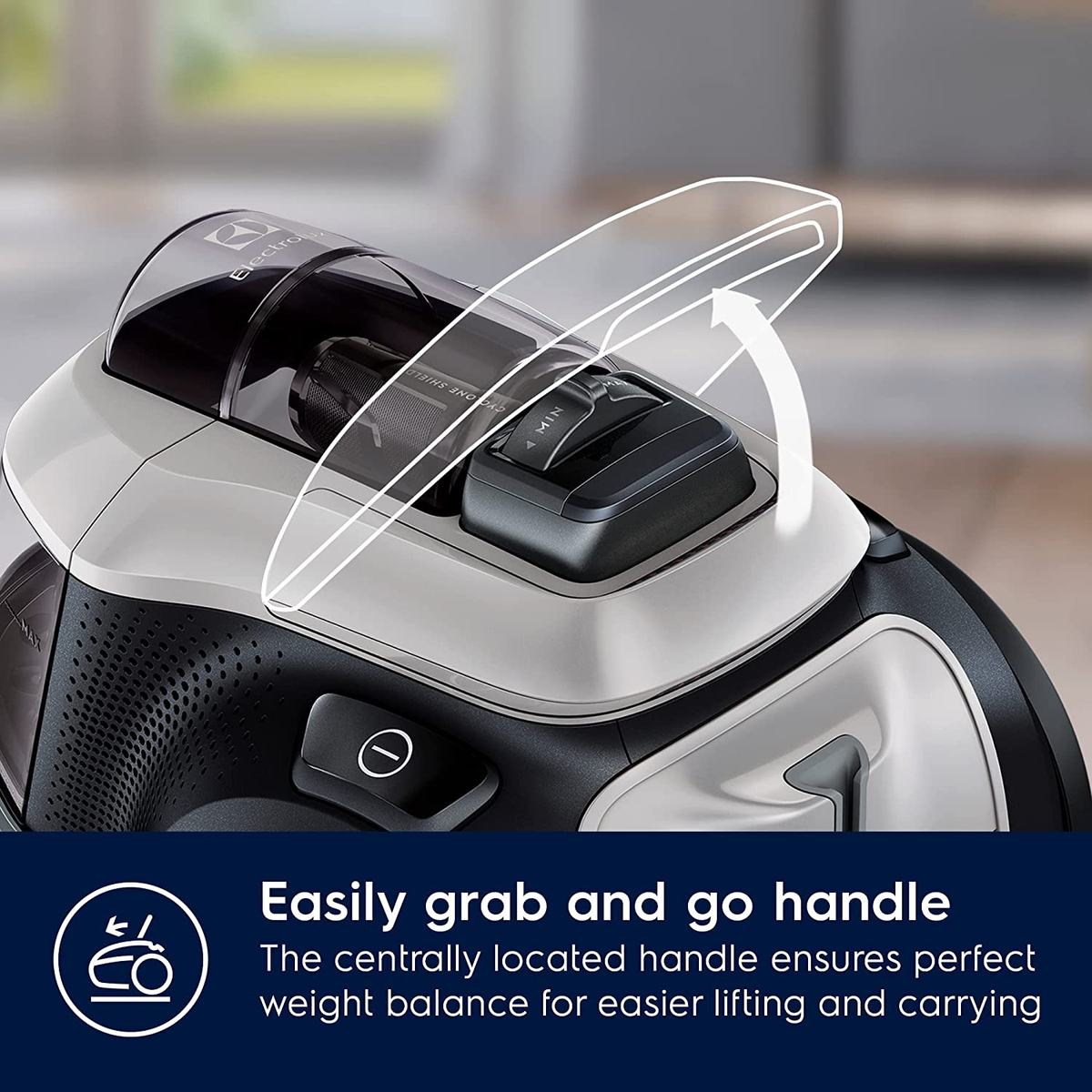 Odkurzacz, częściowo otwarty pokazujący uchwyt i elementy sterujące, tekst poniżej.