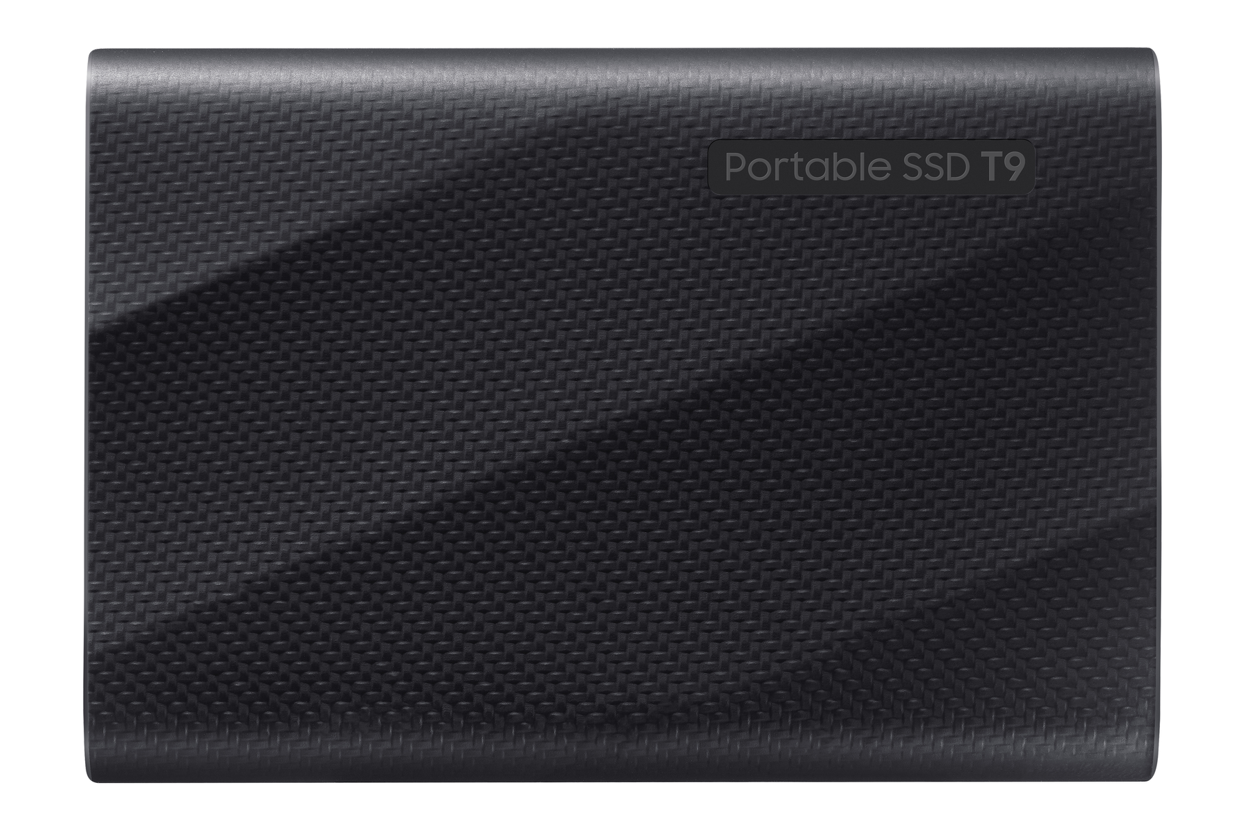 Czarny, teksturowany przenośny dysk SSD. U góry napis 'Portable SSD T9'. Powierzchnia z wzorem tkanym.