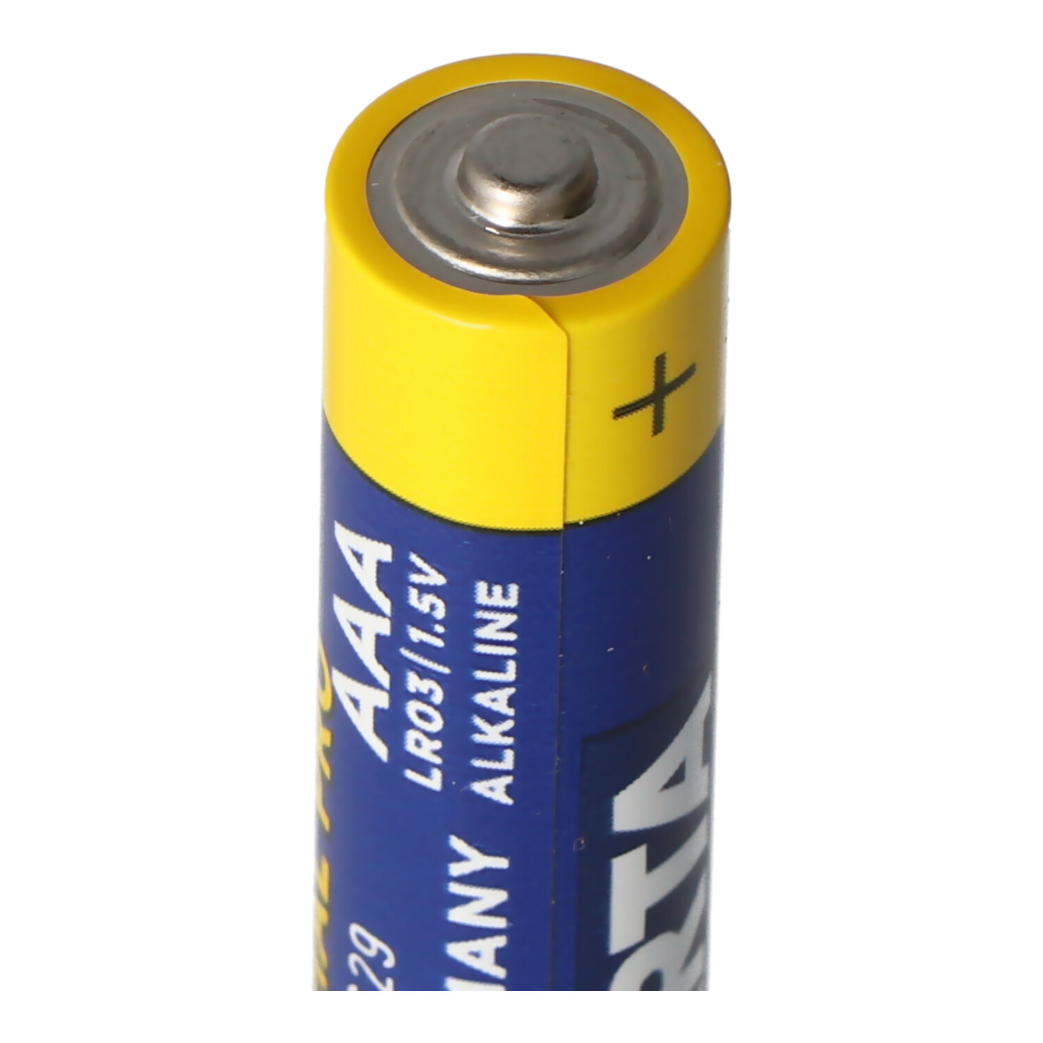 AAA-Batterie. Sie ist gelb und blau. Zeigt das Pluszeichen.