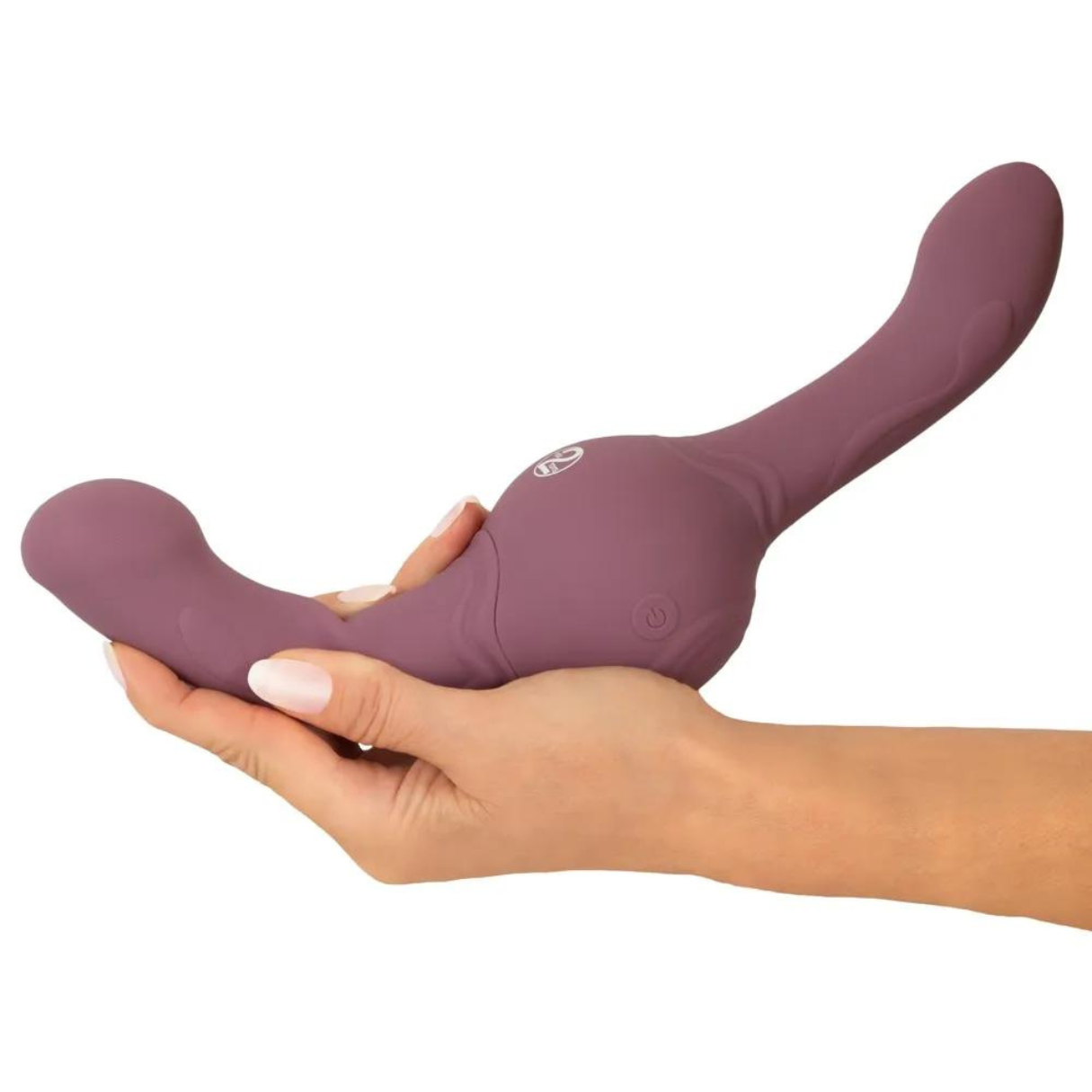 Eine Hand hält ein lila Sexspielzeug. Das Spielzeug ist gebogen.