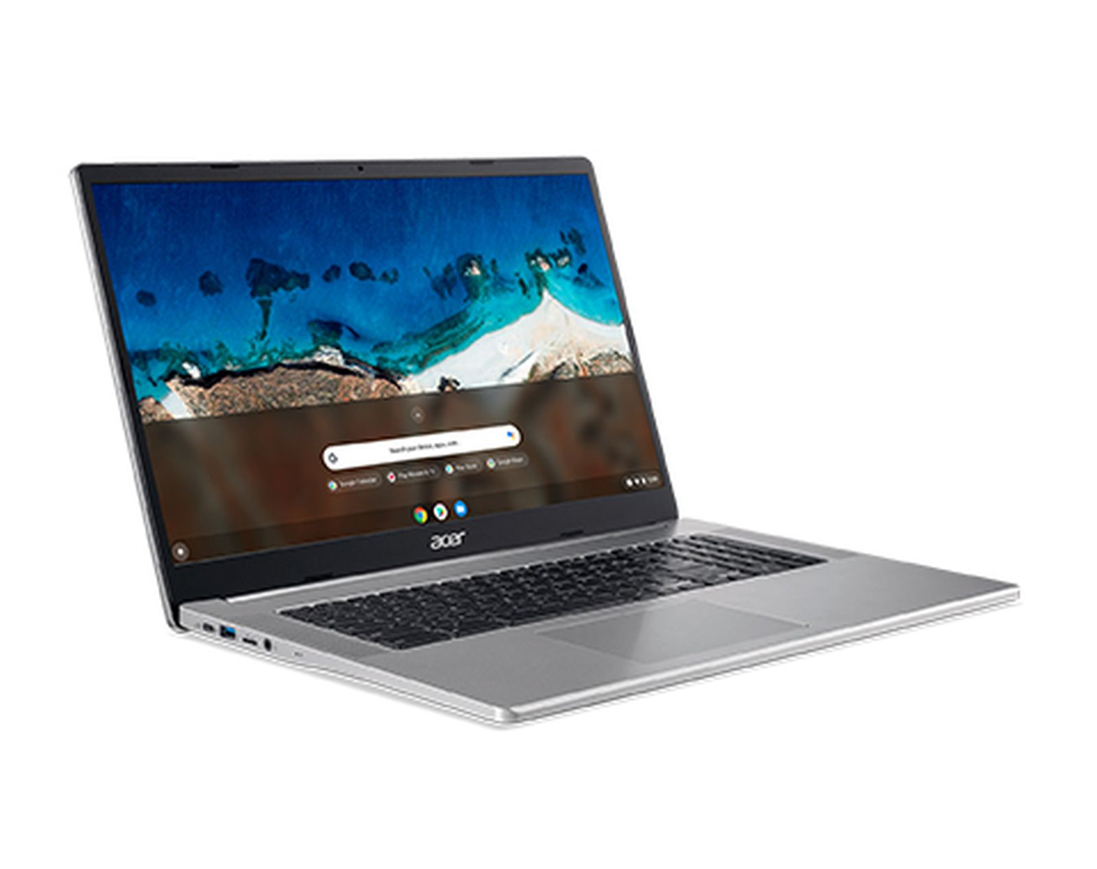 Un laptop Acer argentato è aperto su una superficie bianca. Lo schermo mostra una barra di ricerca.