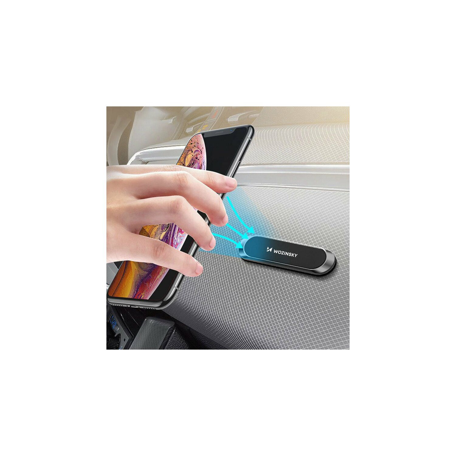 Dłoń umieszczająca telefon na uchwycie samochodowym, widoczny telefon i uchwyt.