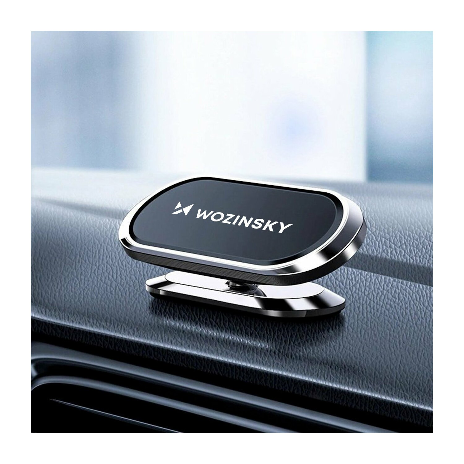 Czarny i srebrny uchwyt na telefon samochodowy na desce rozdzielczej. Logo Wozinsky.