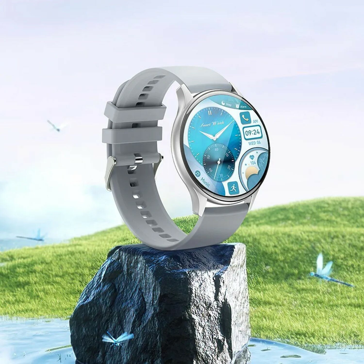 Uno smartwatch grigio con display blu e sfondo azzurro con piccole libellule.