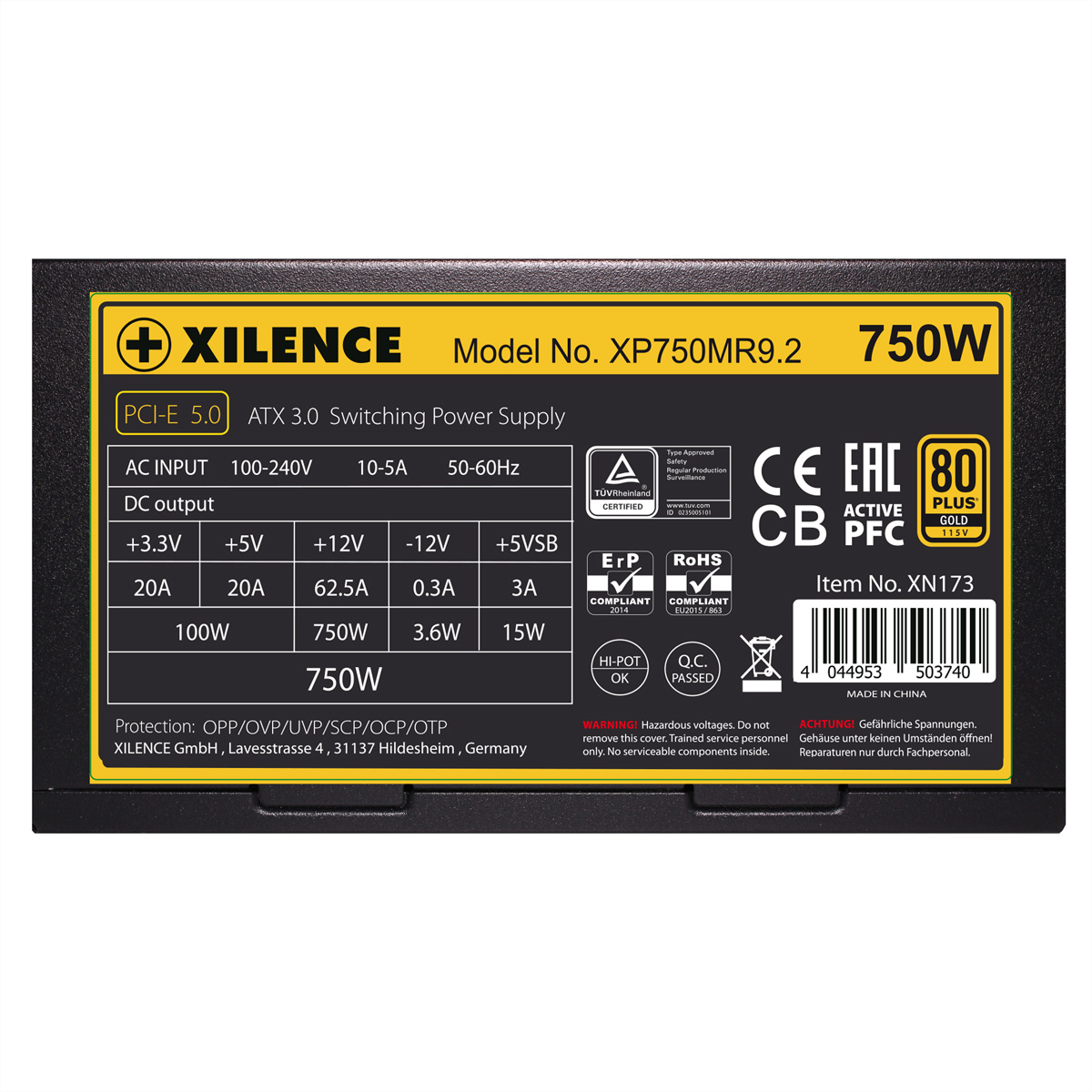 Zasilacz z etykietami pokazującymi specyfikacje i certyfikaty.