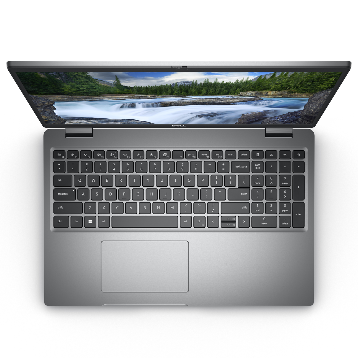 Laptop keyboard angled down. The screen displays a nature scene. The laptop is silver and open.