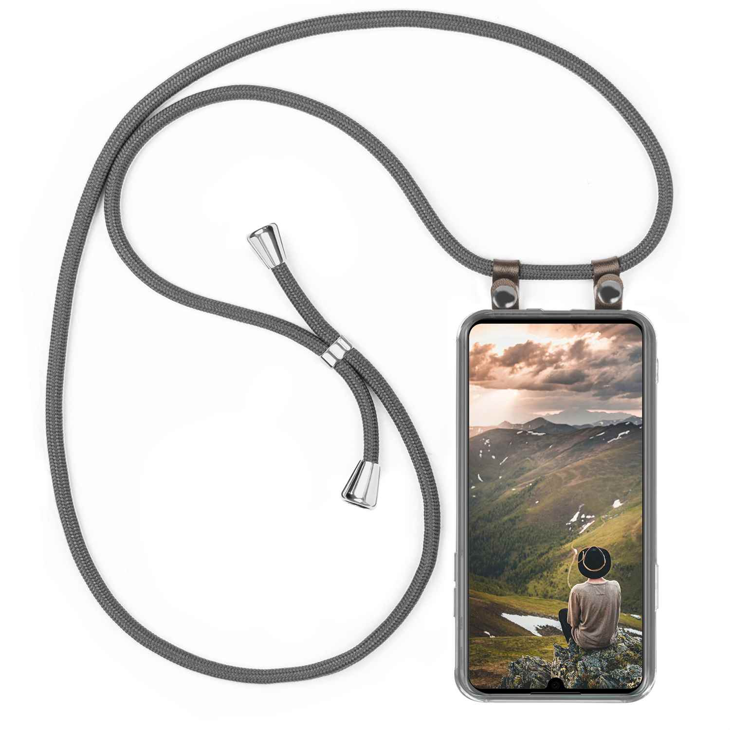 Telefon in einer Hülle mit Band, zeigt eine Landschaft.