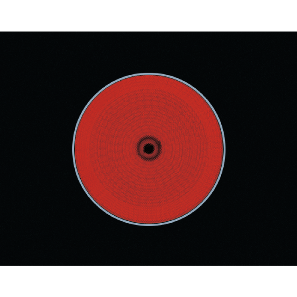 Czerwona płyta indukcyjna z czarnym obszarem centralnym i srebrną obwódką.