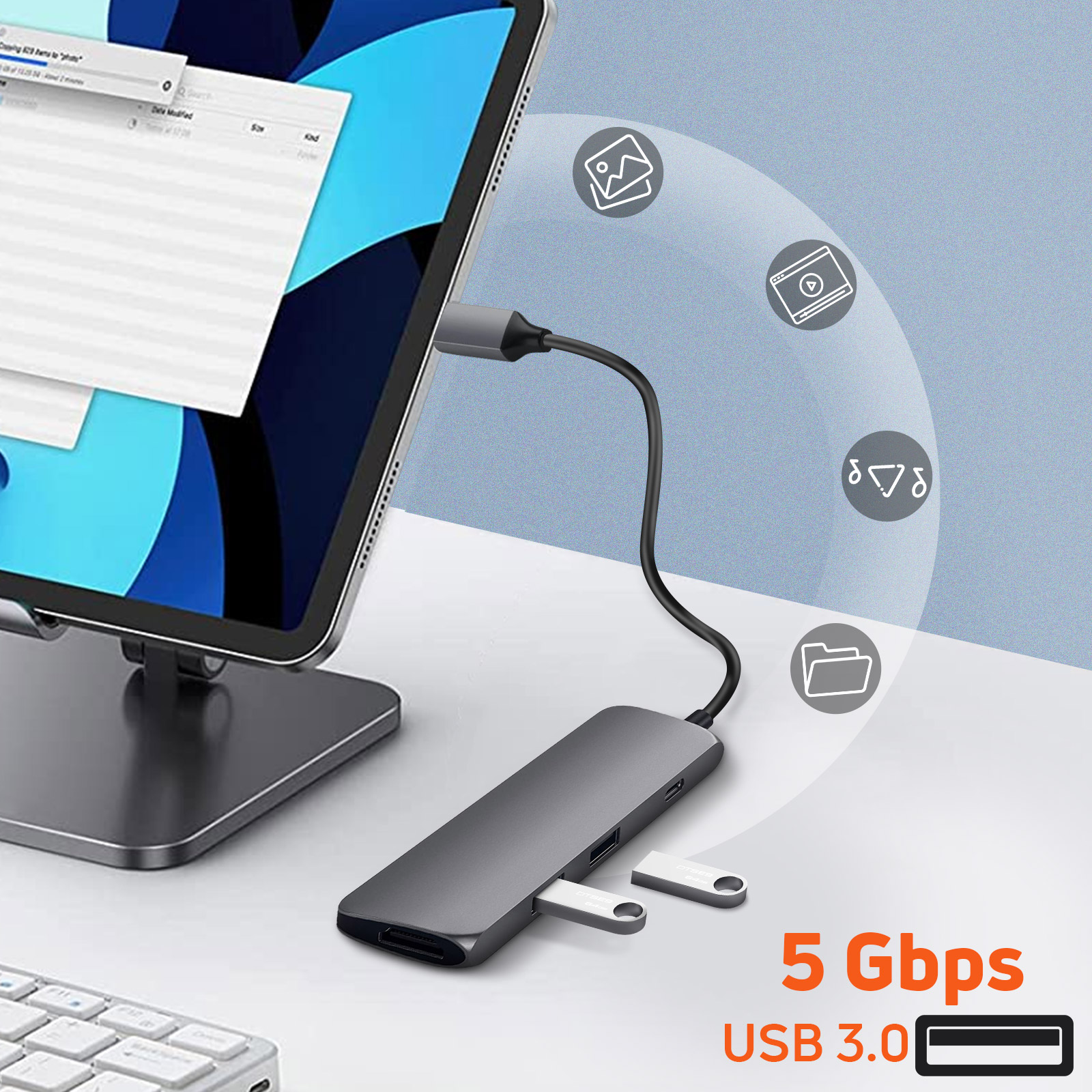 Un concentrador USB gris conectado a una tableta, con unidades USB e iconos de funciones.