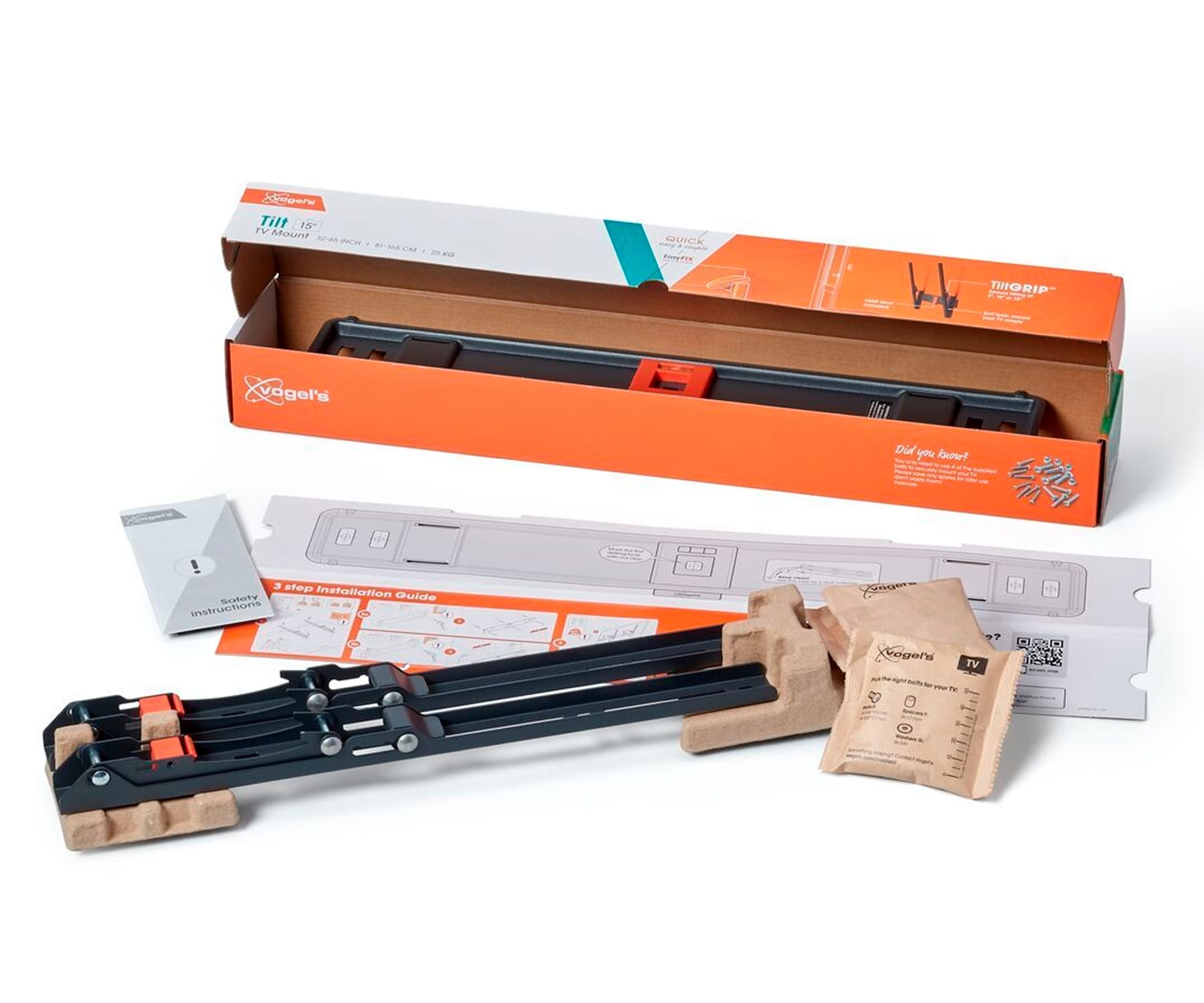 Zestaw do montażu ściennego TV w pudełku. Zawiera uchwyt, instrukcje i akcesoria montażowe.