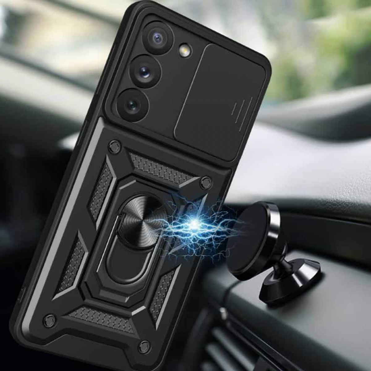 Schwarze Handyhülle mit Ringhalterung auf dem Armaturenbrett, neben einer magnetischen Autohalterung.