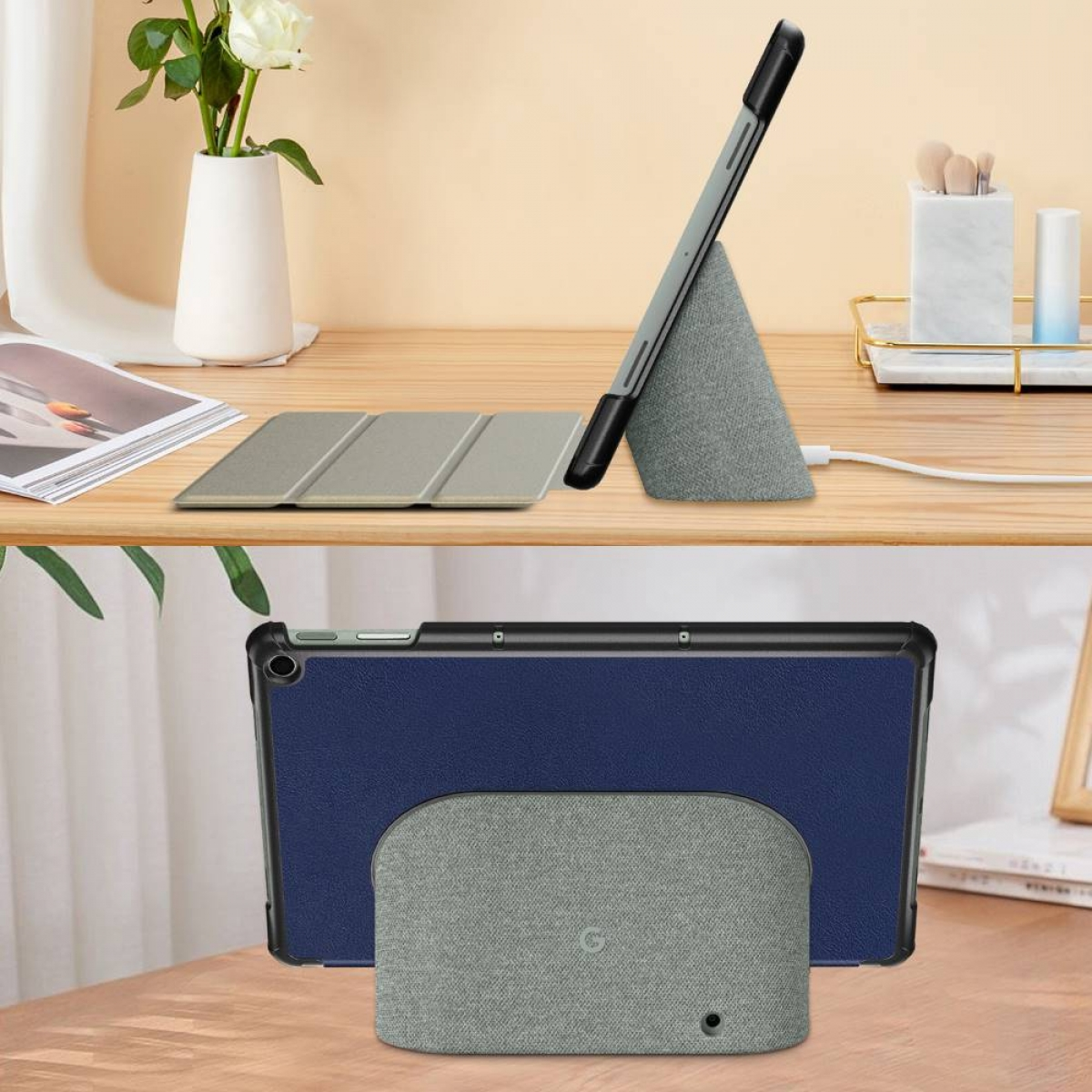 Ein Tablet in einer Hülle, auf einem Ständer aufgestellt. Die Hülle ist dunkelblau. Ein anderes Case unterstützt es.