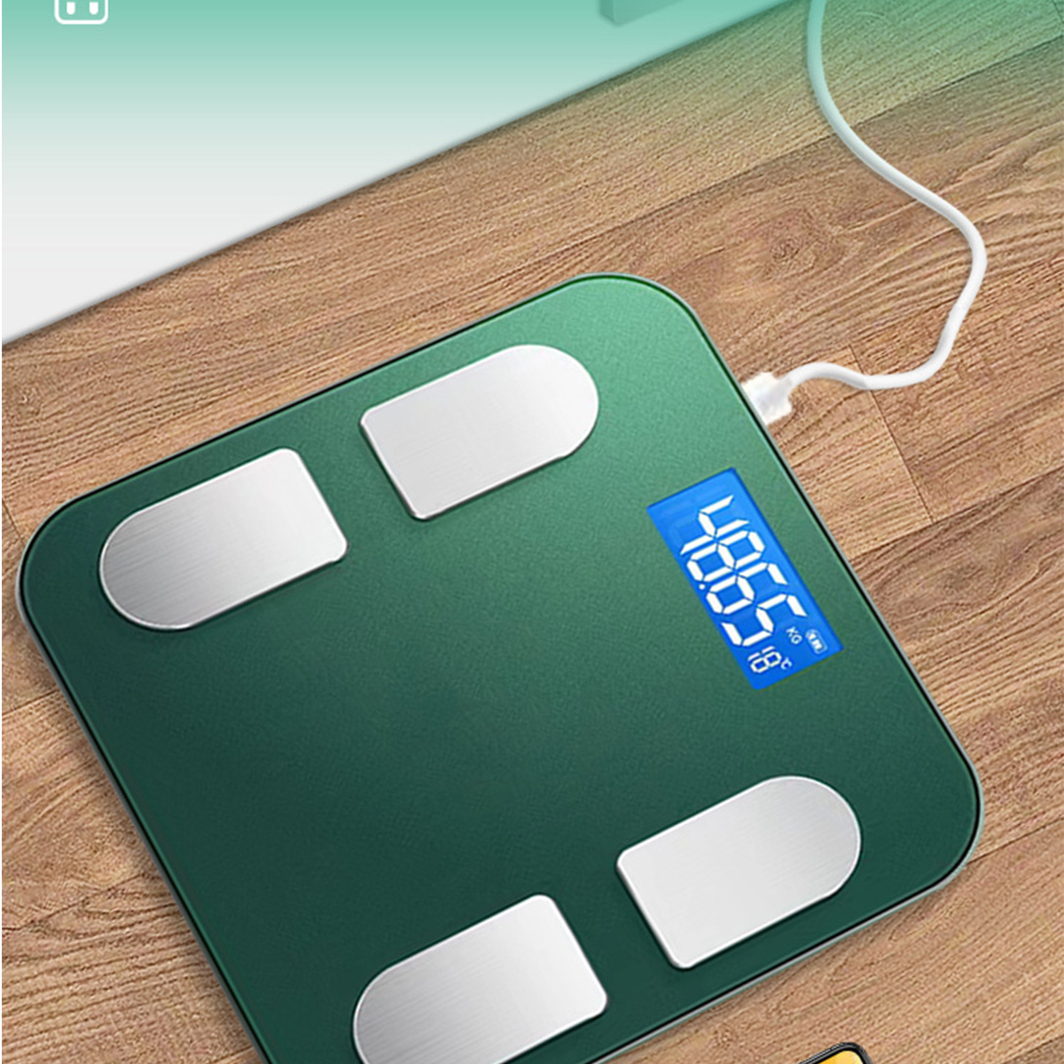 Eine grüne intelligente Waage mit einem Gewicht von 48,65 kg und 18 Grad. An einem weißen Kabel angeschlossen.