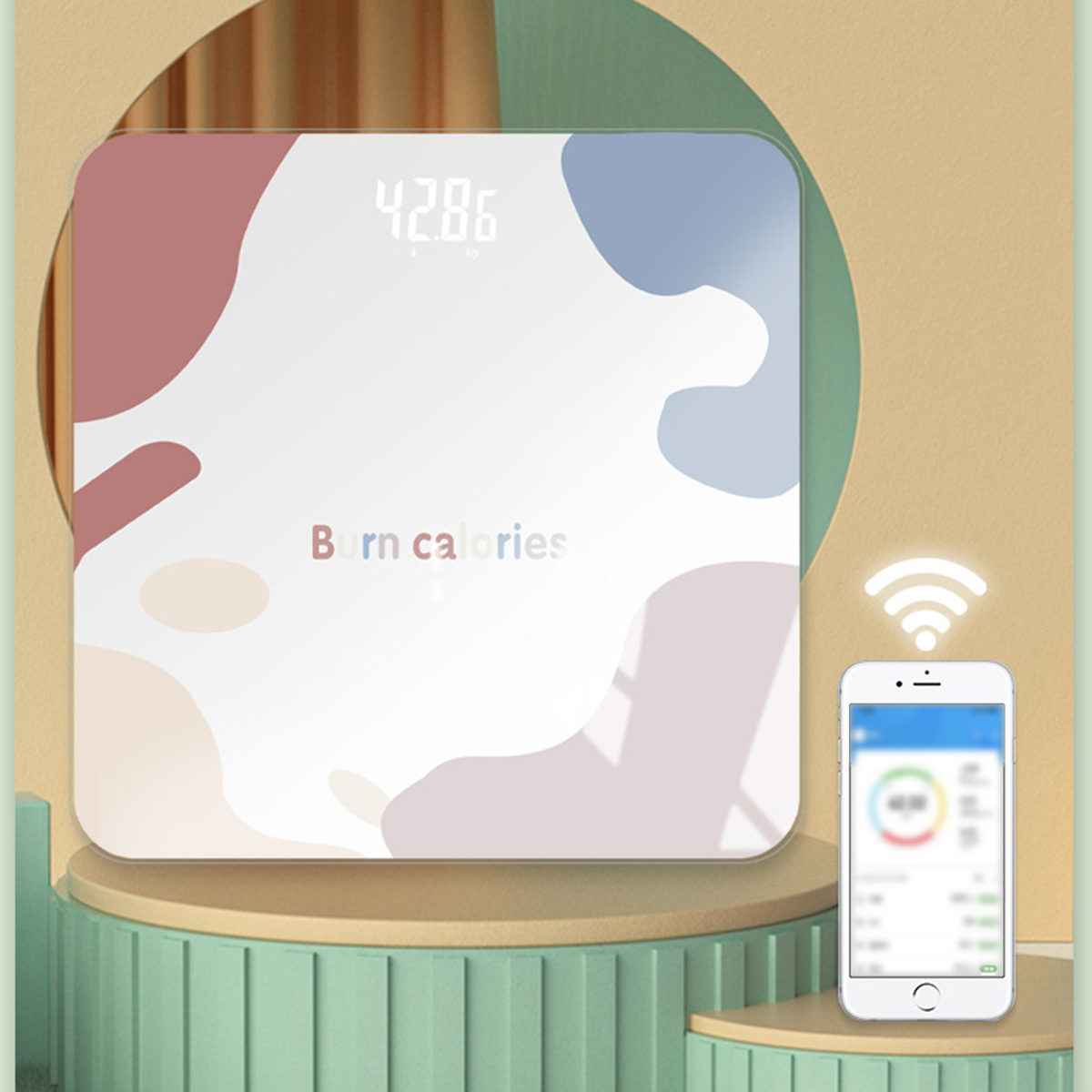 Weiße Waage mit bunten Farbspritzern und einem Mobiltelefon. Der Text lautet „Kalorien verbrennen“ und zeigt das Gewicht an.