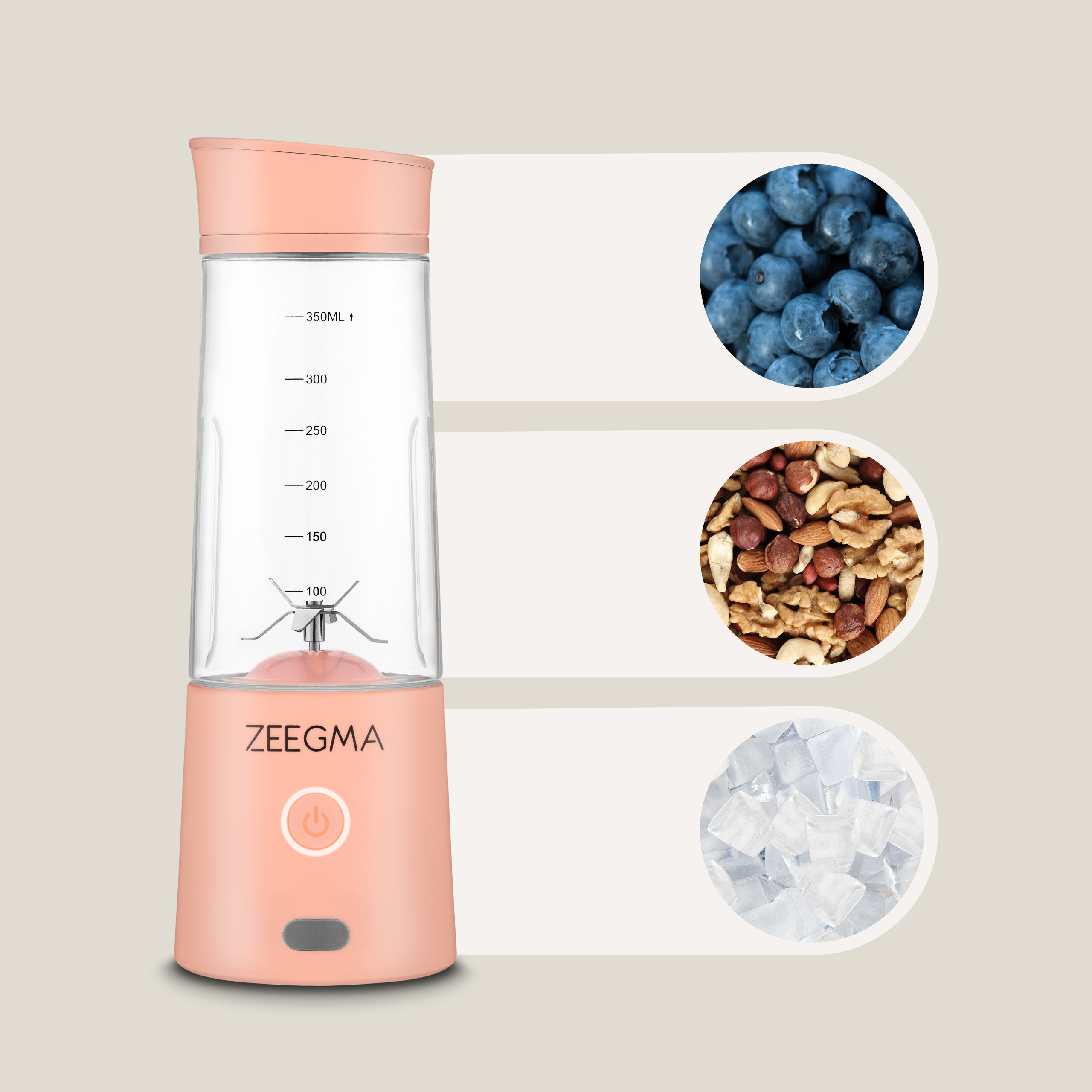 Różowy blender Zeegma z przezroczystym pojemnikiem. Wyświetla jagody, orzechy i kostki lodu.