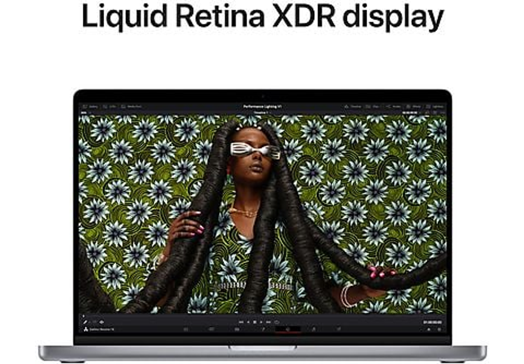 Laptop displays a woman with long braids. The background has a floral pattern. The text 'Liquid Retina XDR display'.