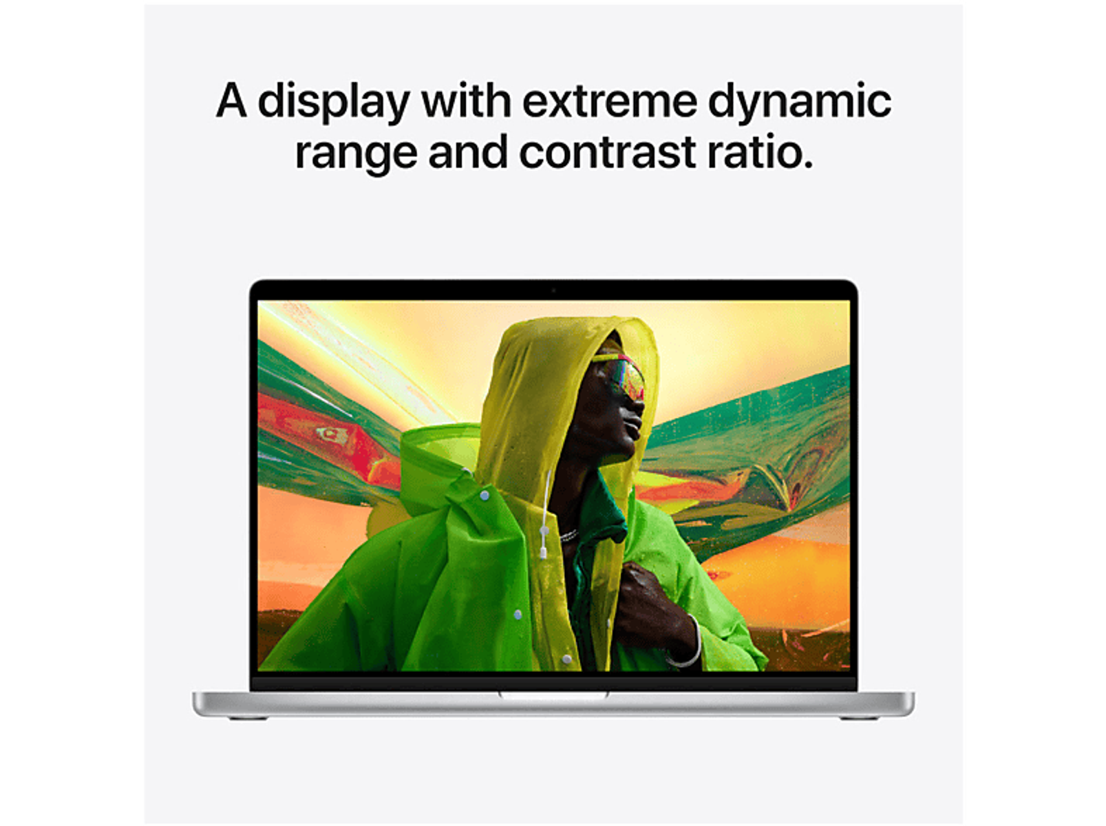 Laptop screen showing a person in a yellow rain jacket. Text: A display with extreme dynamic range.