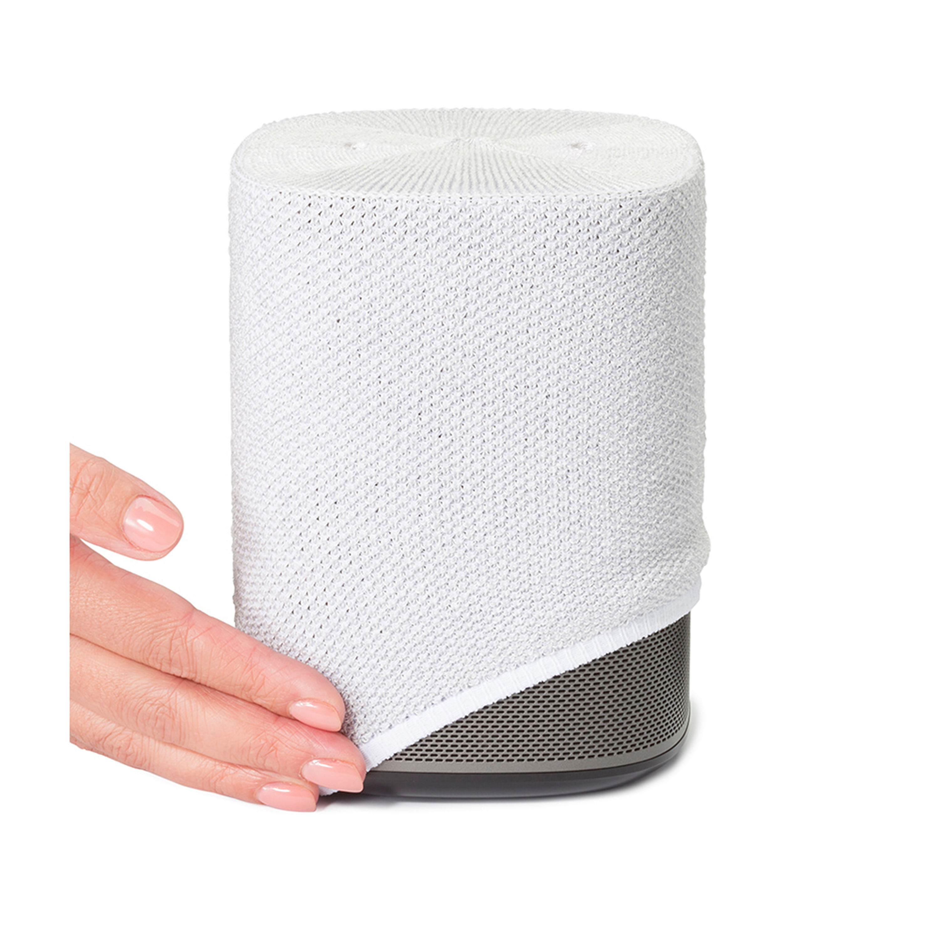Haut-parleur blanc avec une main retirant le couvercle blanc.