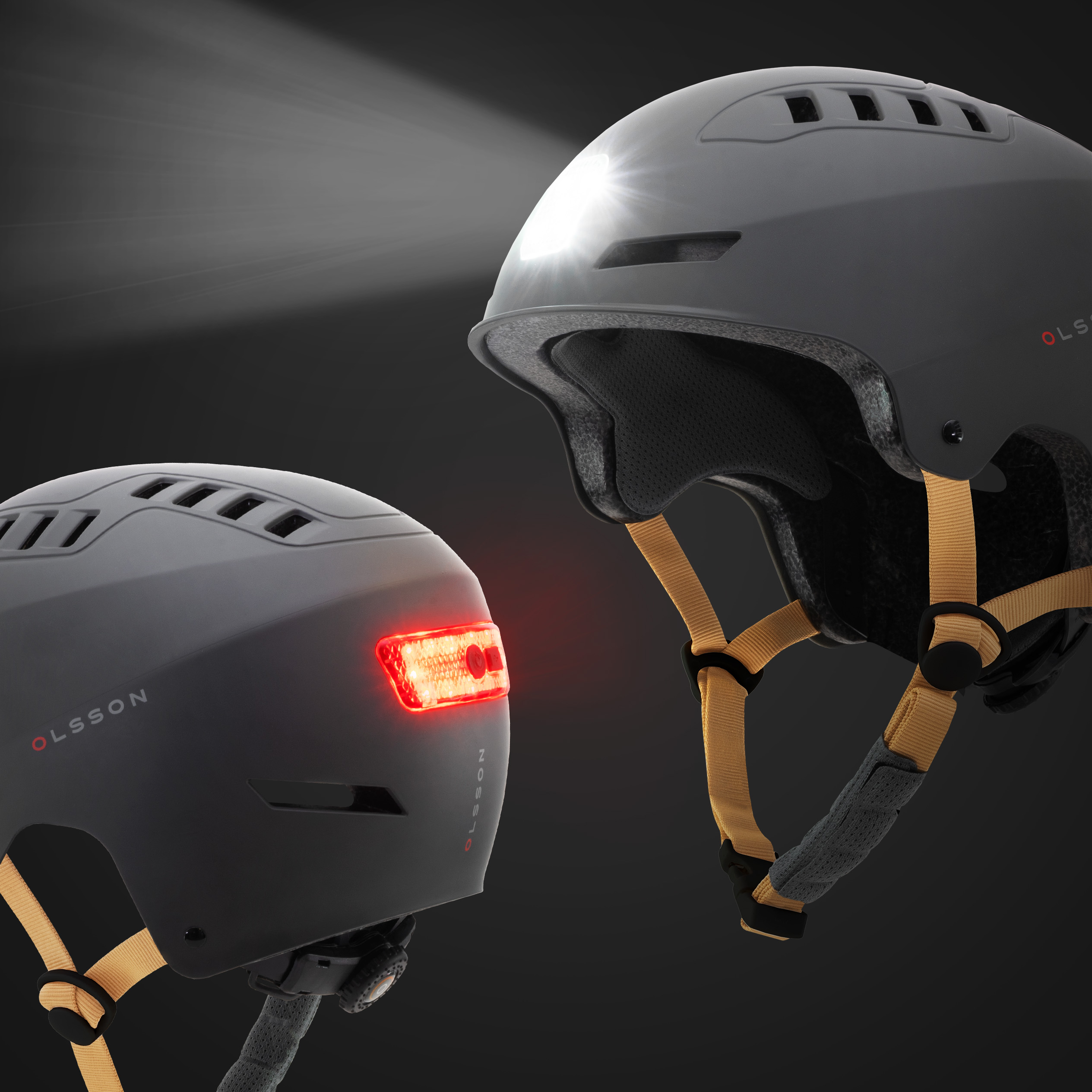 Dos cascos de bicicleta; uno con faro encendido, el otro con luz trasera roja. Ambos grises con correas doradas.