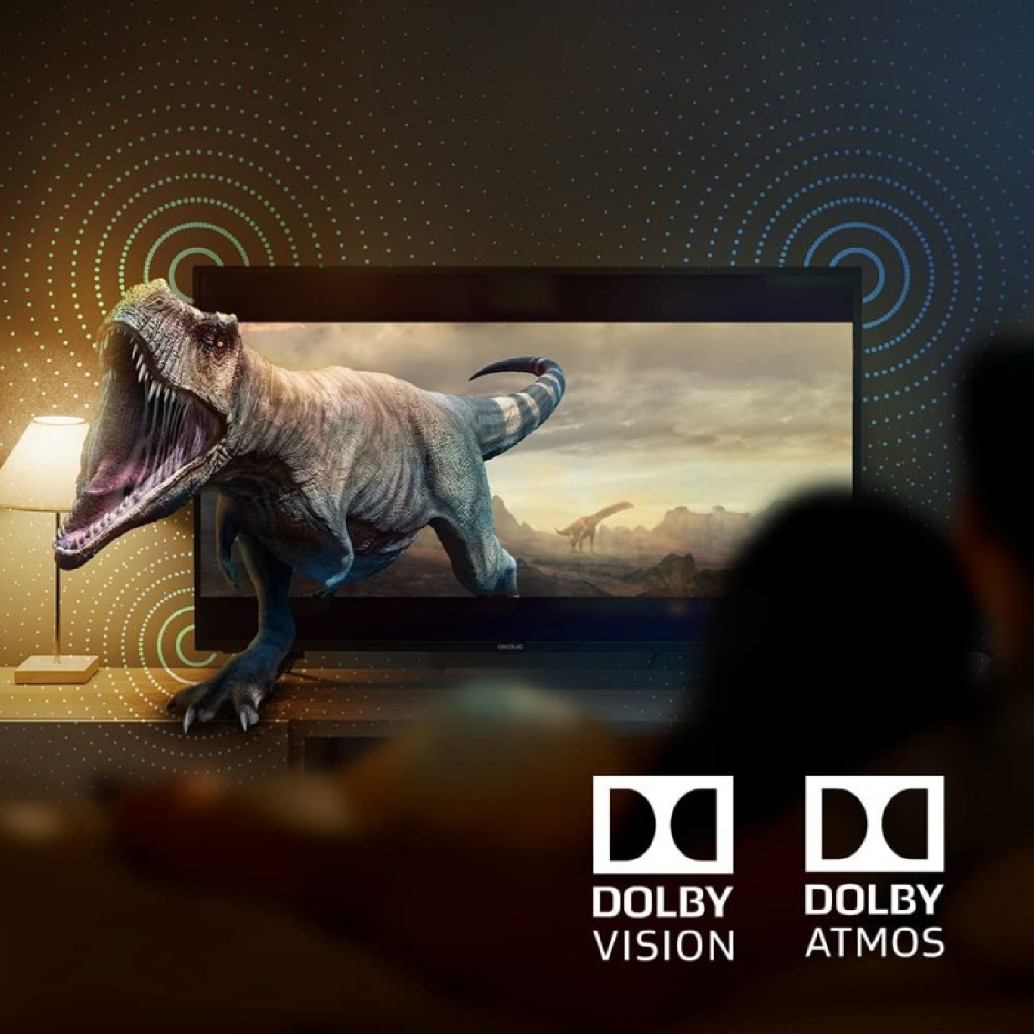 Una pantalla de TV muestra un dinosaurio. Debajo, logotipos de Dolby Vision y Atmos.