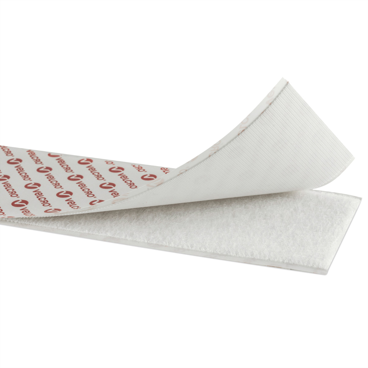Weißer Klettstreifen wird geöffnet, wodurch die Textur des Klettverschlusses und die Marke 'Velcro' sichtbar werden.