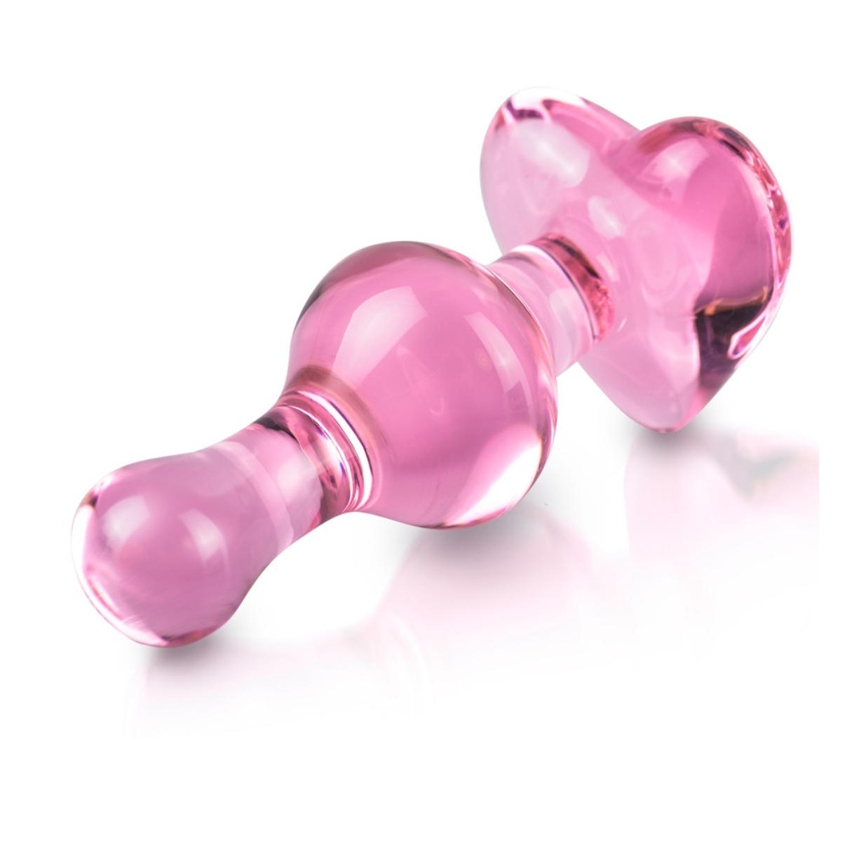 Ein pinkfarbener Glas-Analplug. Er hat eine abgerundete Spitze und eine herzförmige Basis. Weißer Hintergrund.