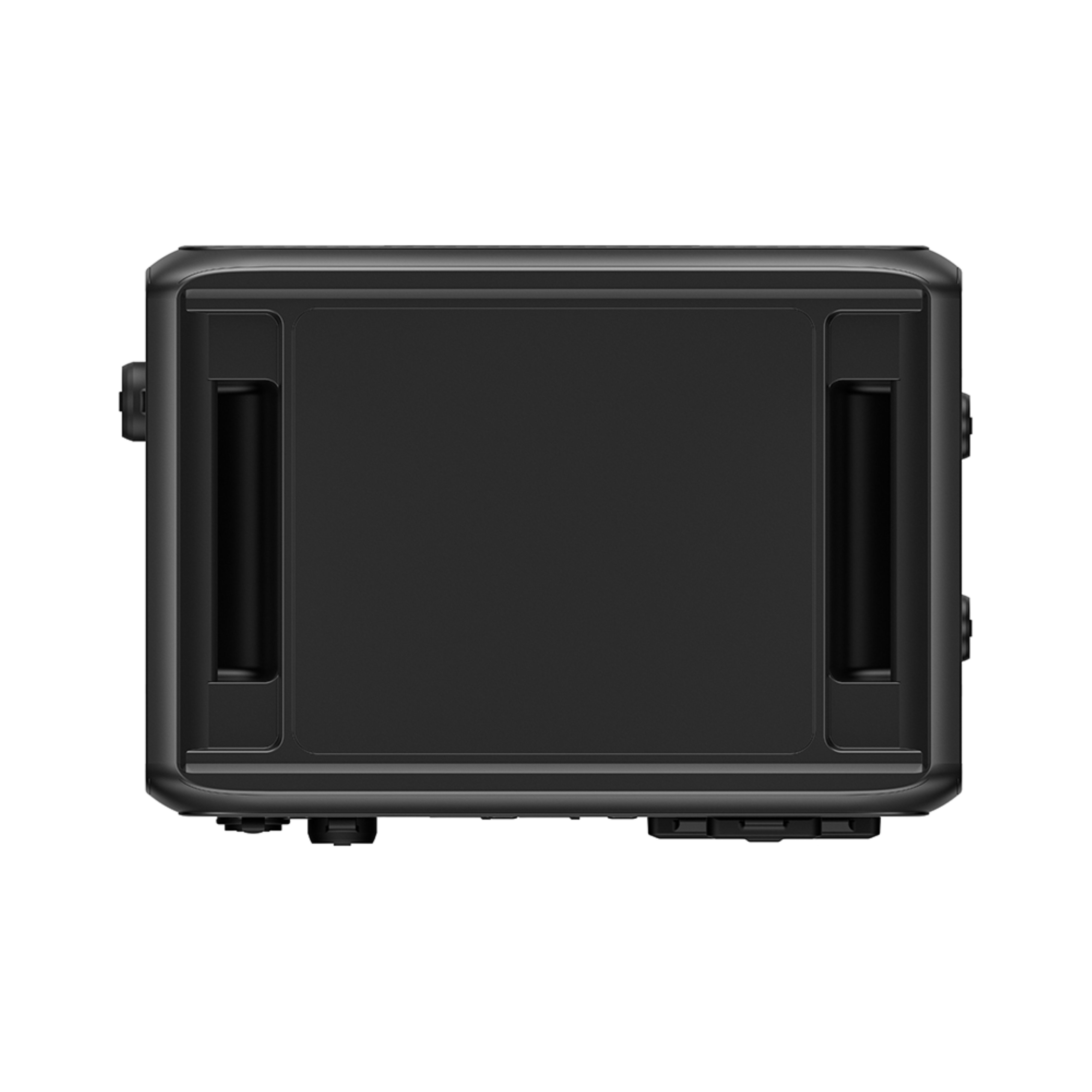 Czarna prostokątna skrzynka z uchwytami i przyciskami. Jest to widok z góry.