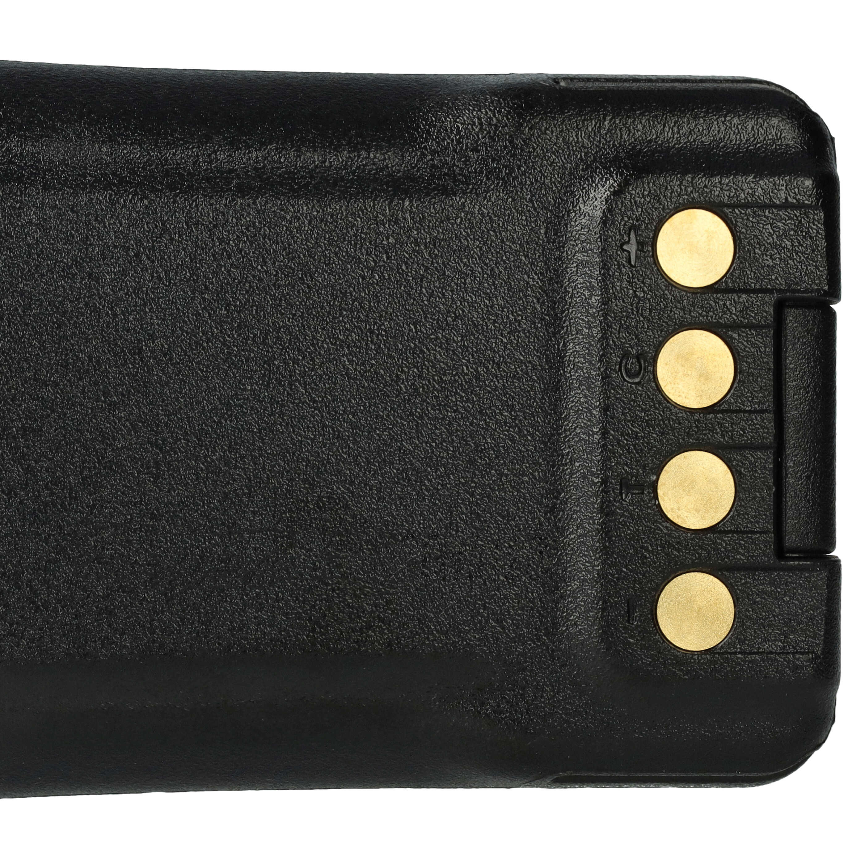 Nahaufnahme einer schwarzen Batterie mit drei goldfarbenen Kontakten. Die Batterie hat eine strukturierte Oberfläche.