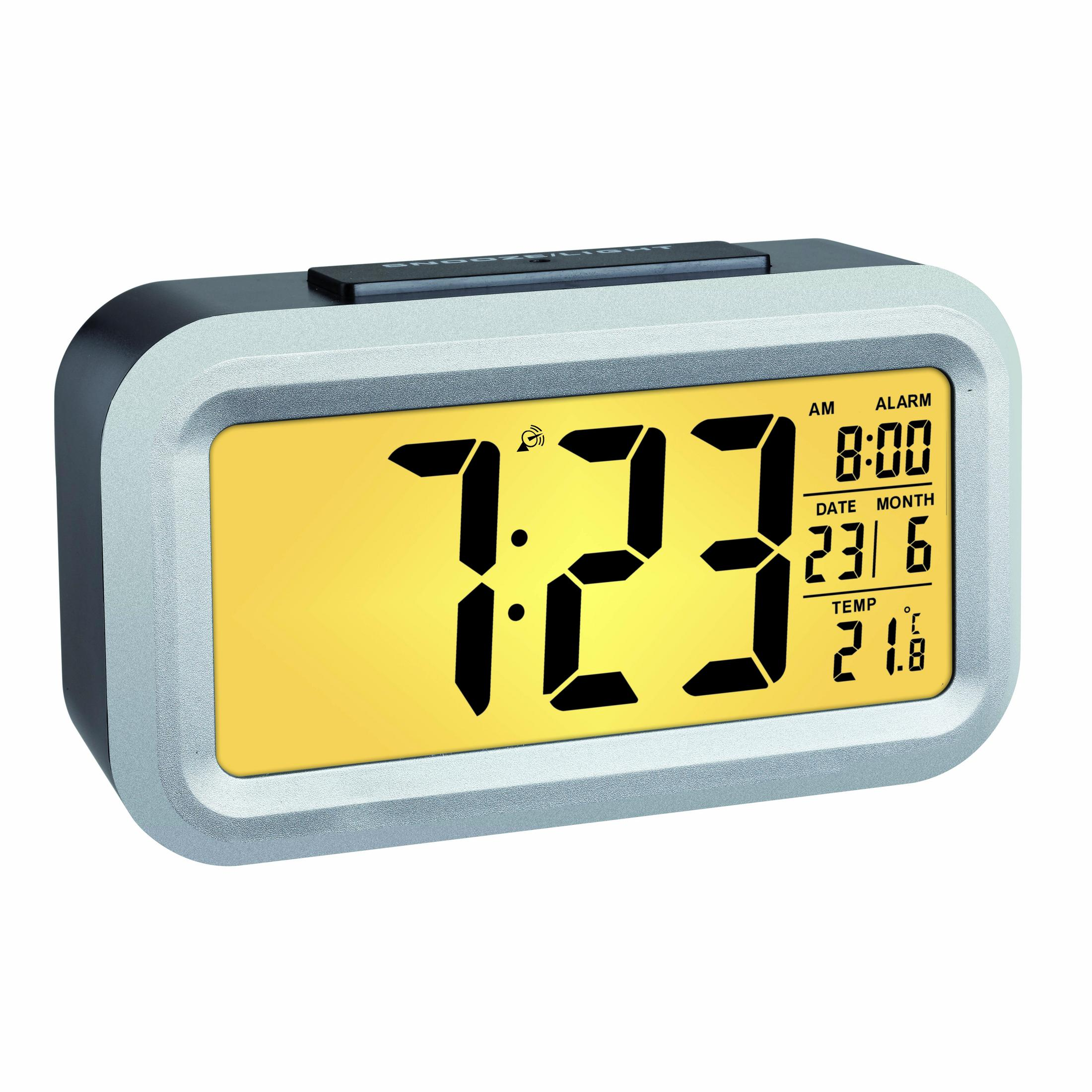 Digitaler Wecker. Zeigt Uhrzeit, Datum und Temperatur an. Er hat ein grau-gelbes Design.