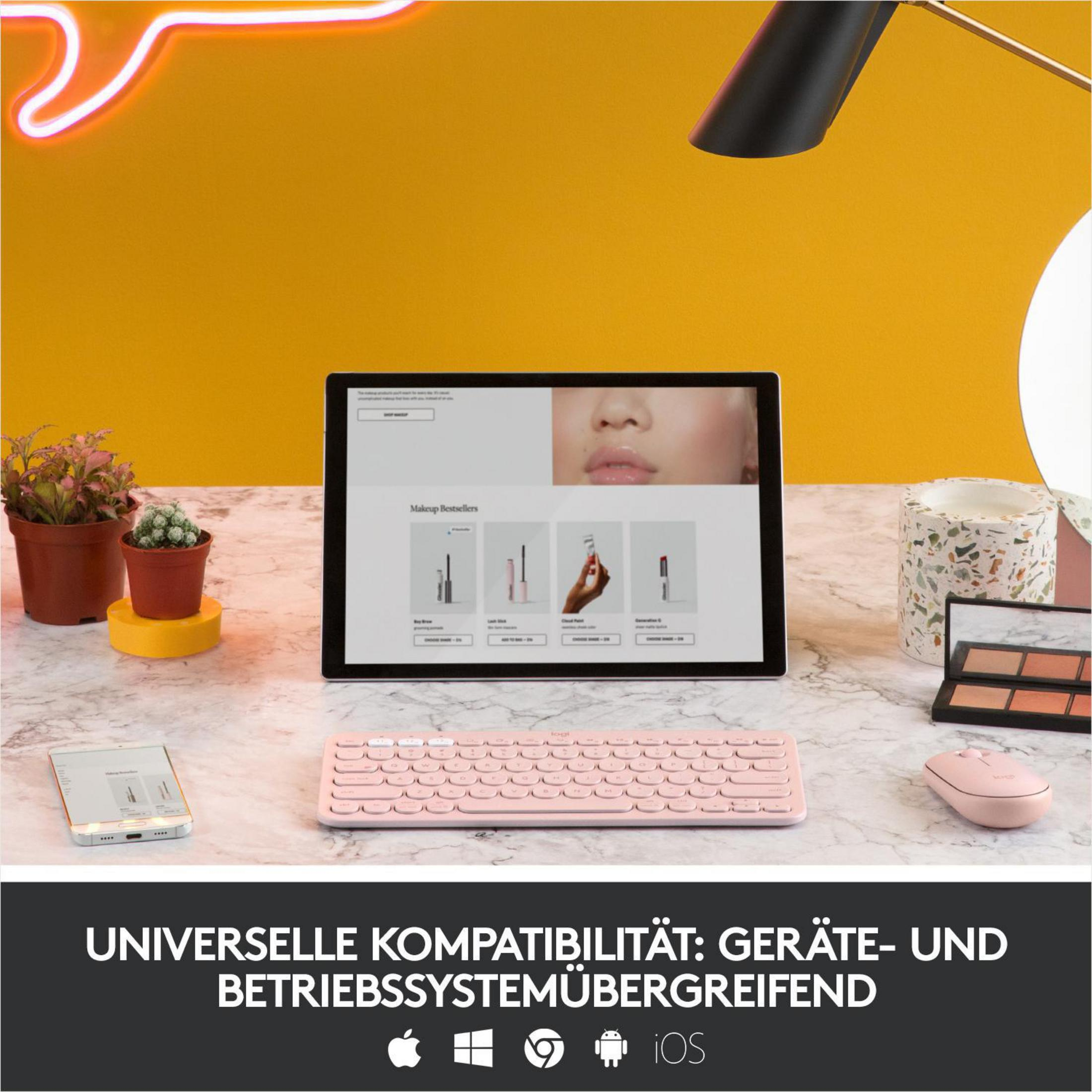 Biurko z tabletem, różową klawiaturą i myszą. Tło jest żółte.