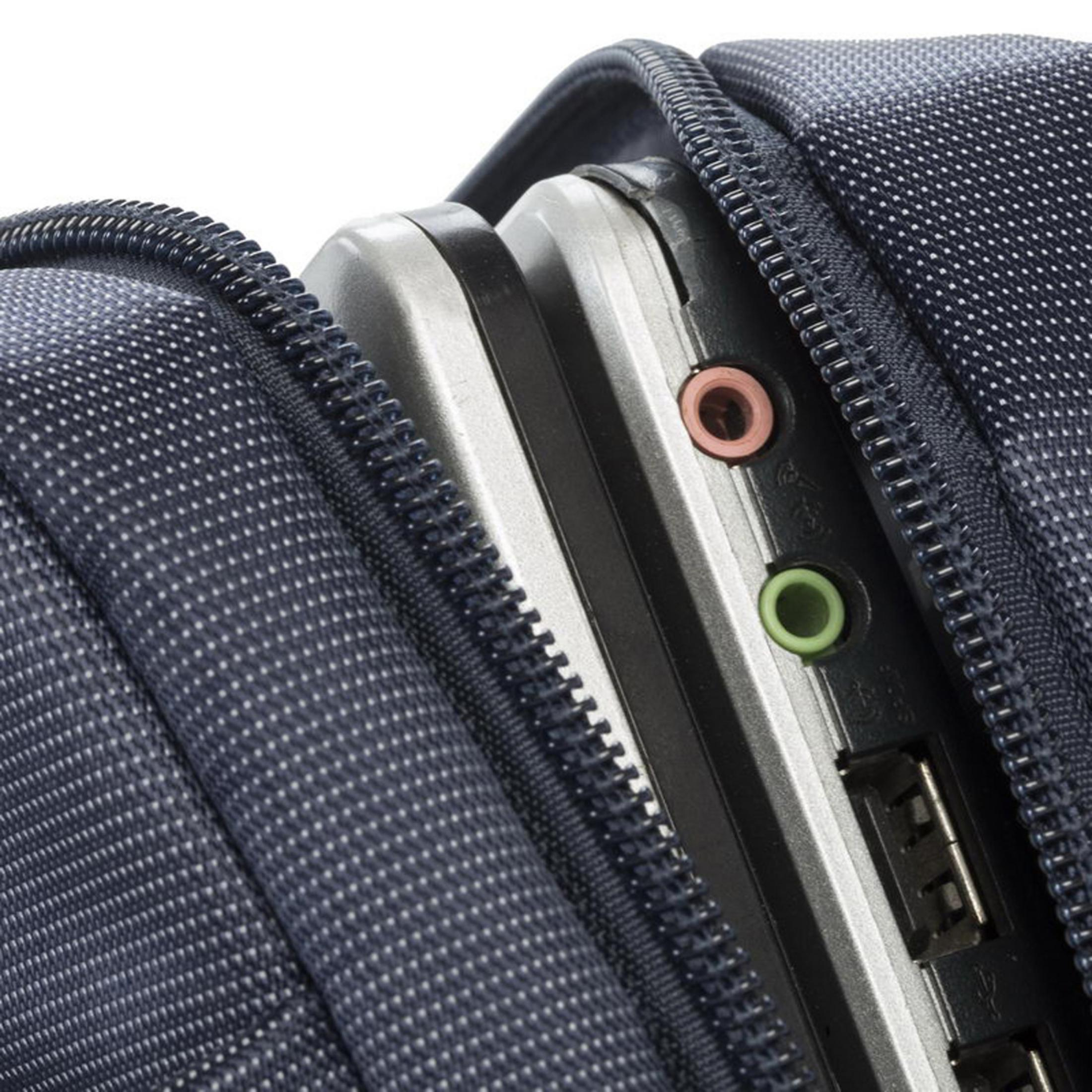 A laptop inside a blue fabric case. Visible ports with red and green audio jacks.
