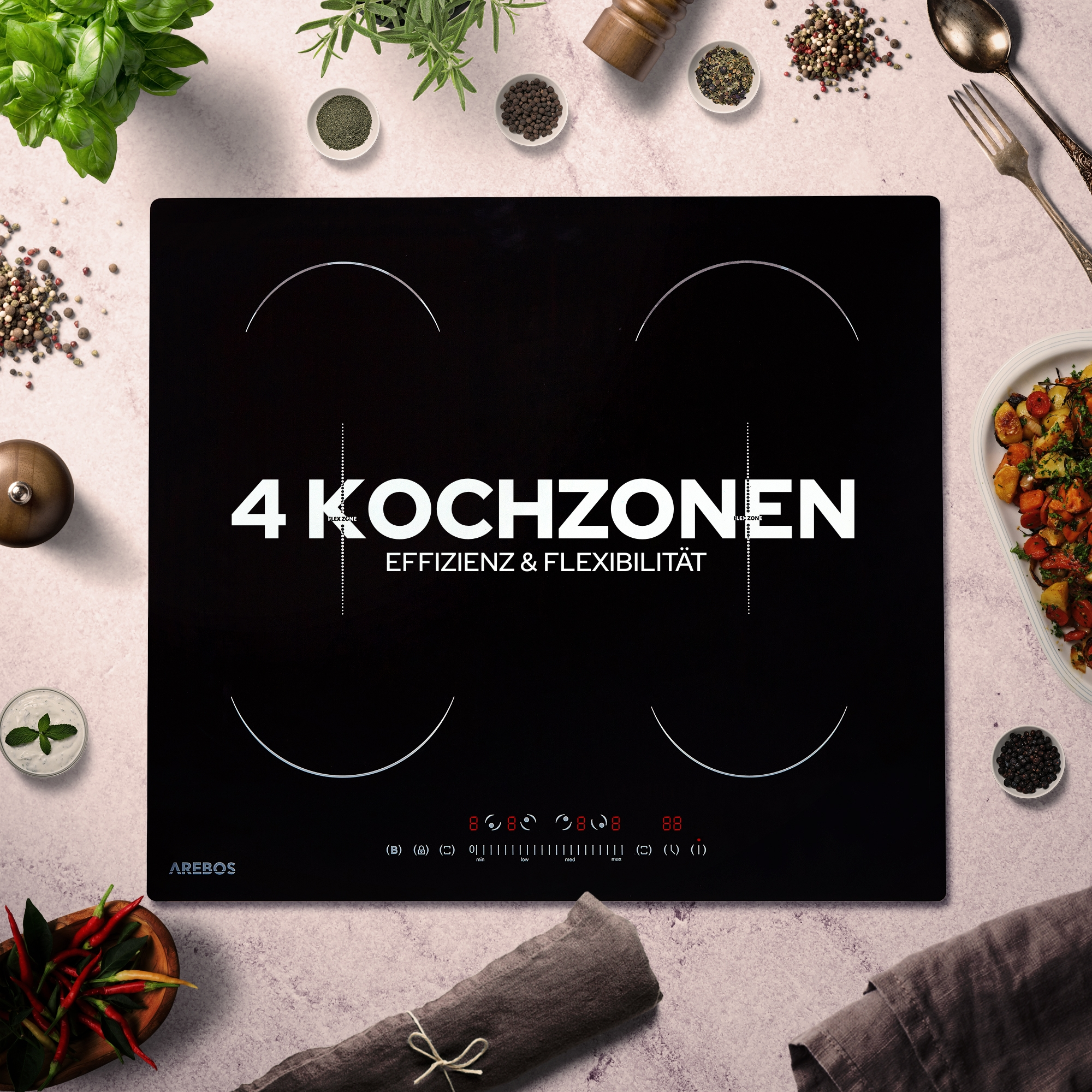 Schwarzes Induktionskochfeld mit vier Kochzonen, Text: 4 KOCHZONEN. Umgeben von Zutaten und Utensilien.