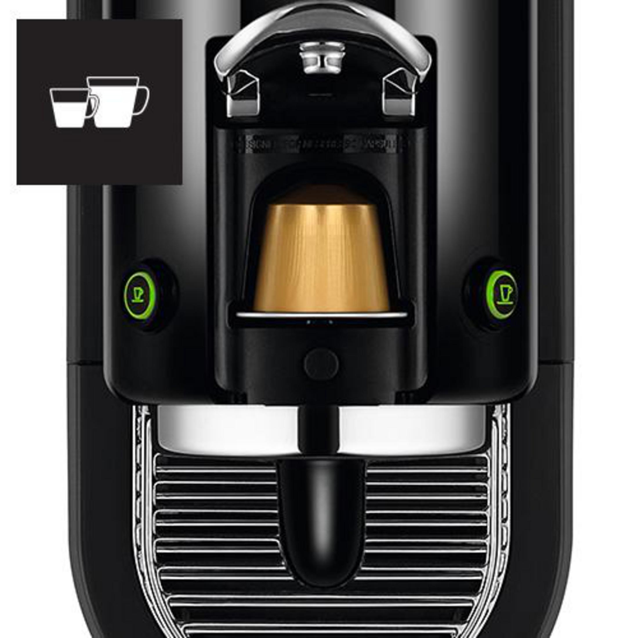 Czarny ekspres do kawy ze złotą kapsułką w środku i dwoma ikonami filiżanek na czarnej powierzchni.