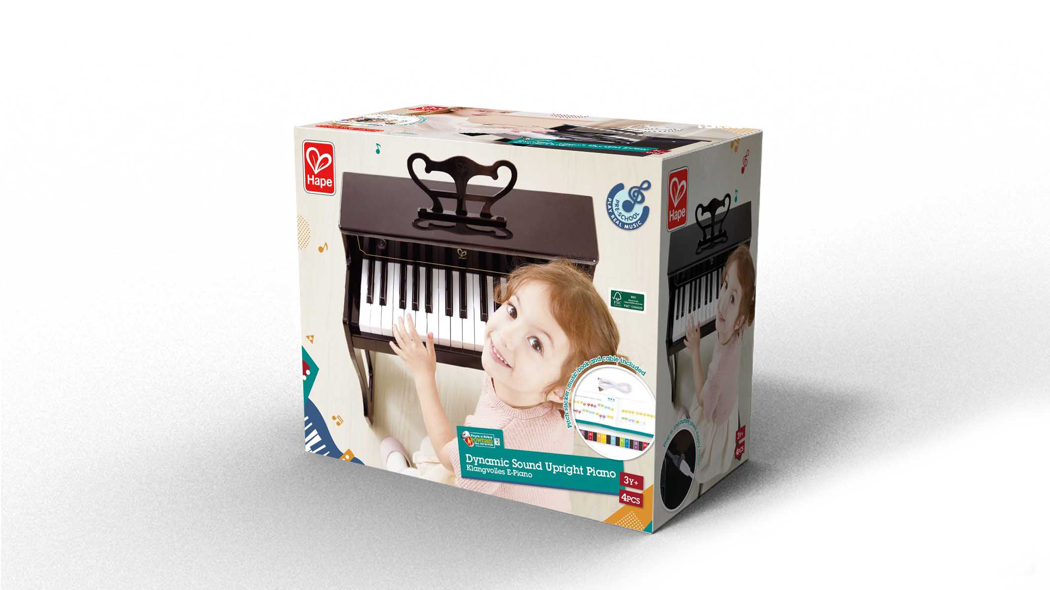 Klavierspielzeugbox mit Kinderfoto und dem Klavier im Inneren.