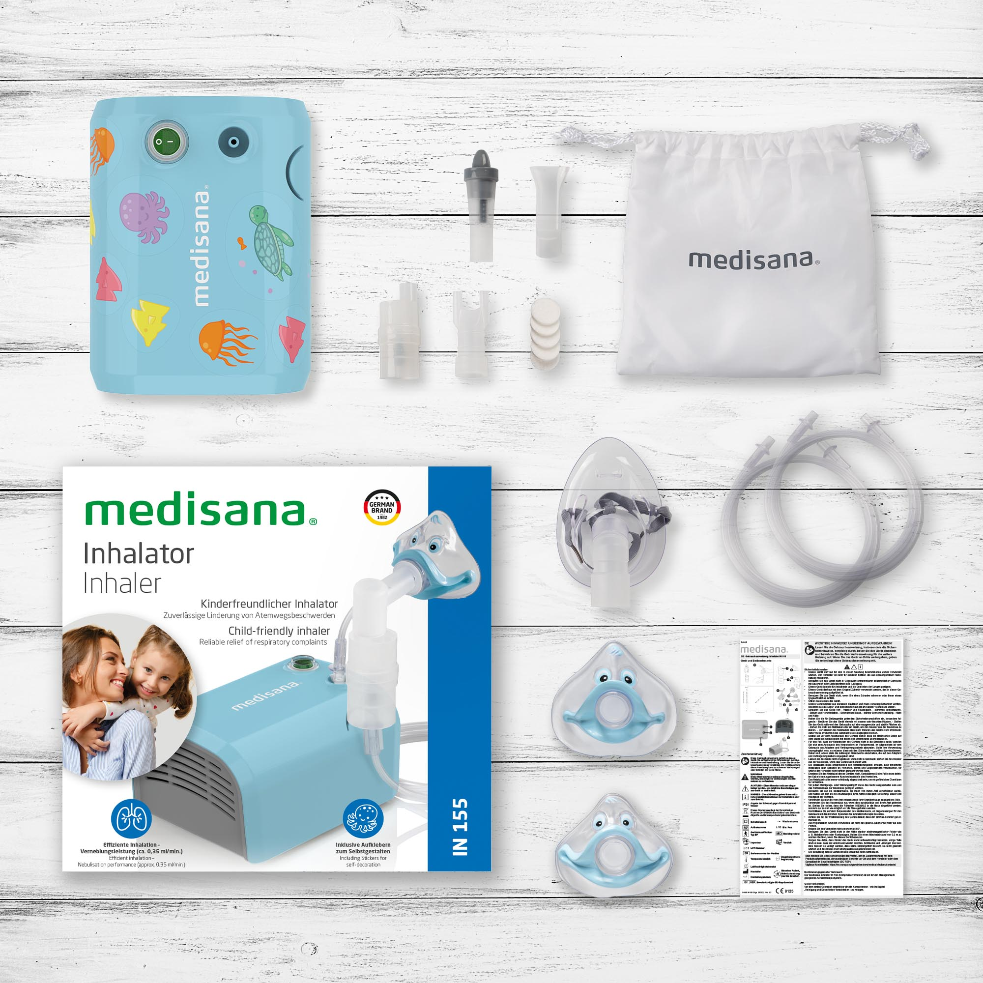 Inhaler kit with various components laid out on a wooden surface.